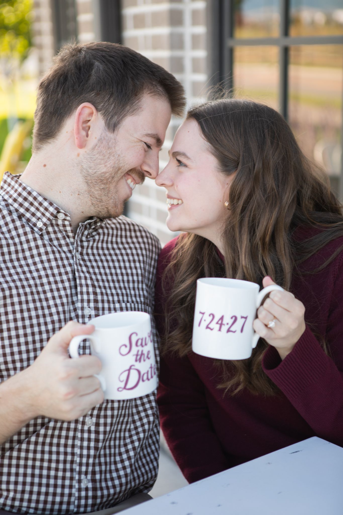 A Montana couple celebrating their engagement and taking their save the date pictures in Bozeman, Montana.