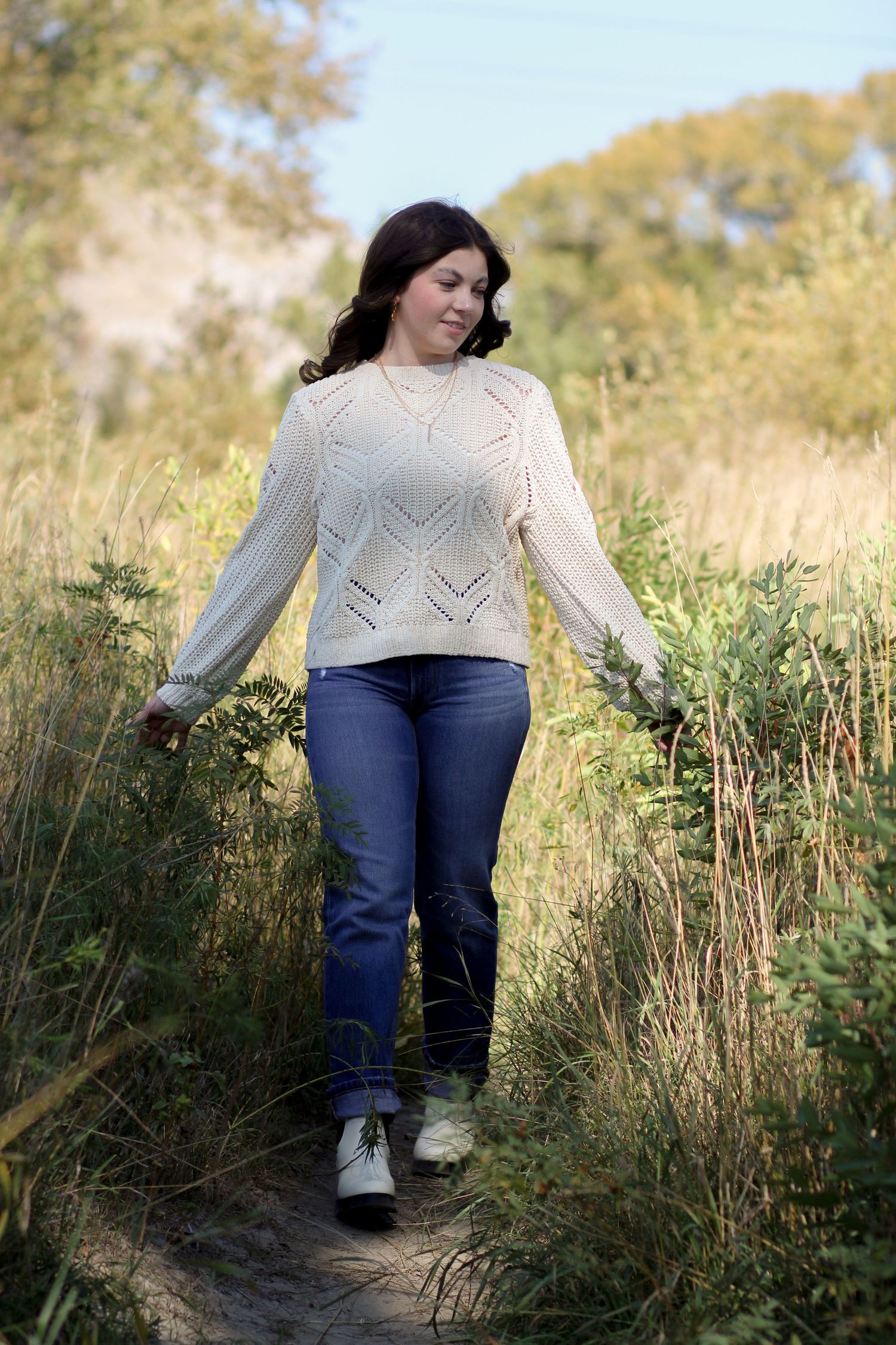 A Bozeman Senior walking down a path in a field in the Gallatin Valley