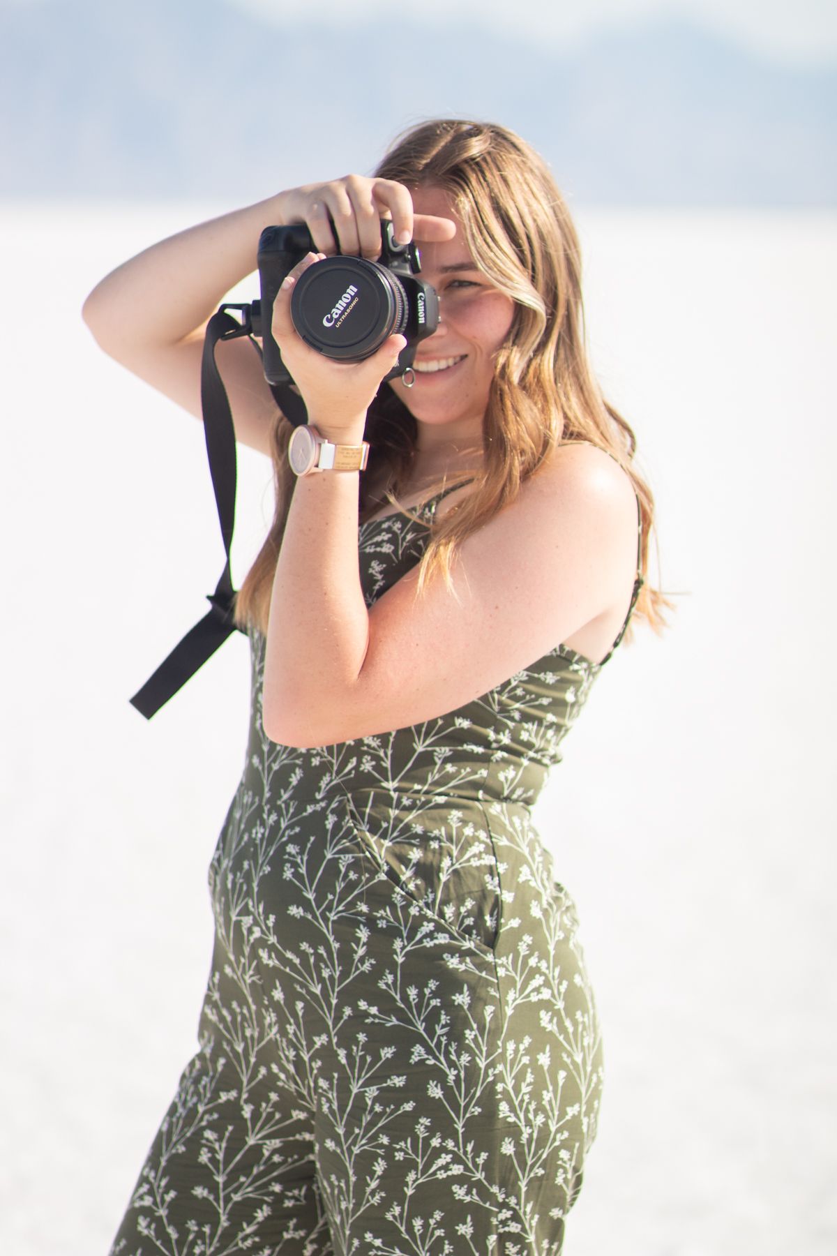 Photographer Sierrah Elizabeth using her camera on the Bonneville Salt Flats.
