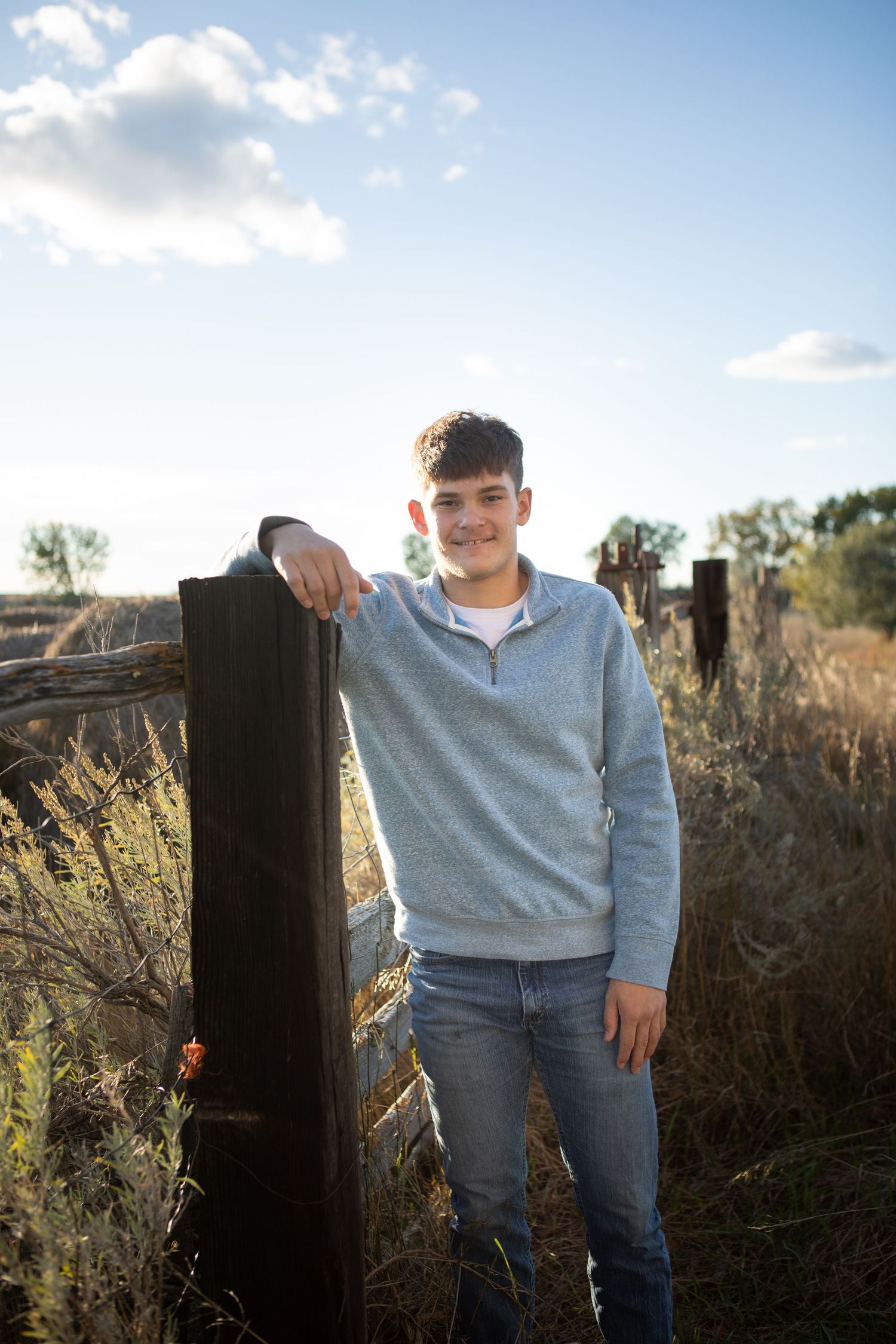 A Montana Senior learning against a post in Eastern Montana.