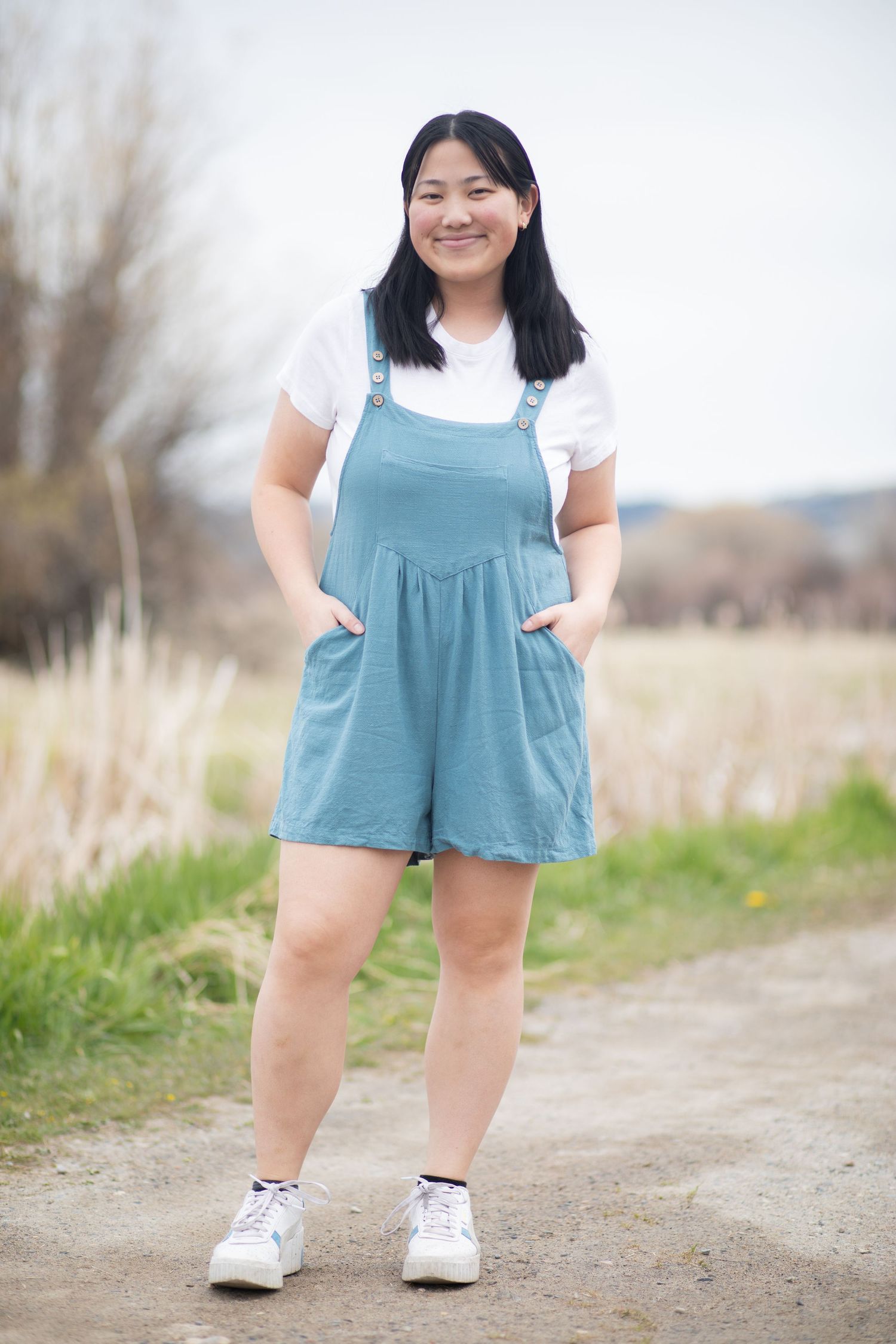 A Bozeman Senior posing on a road in Bozeman.