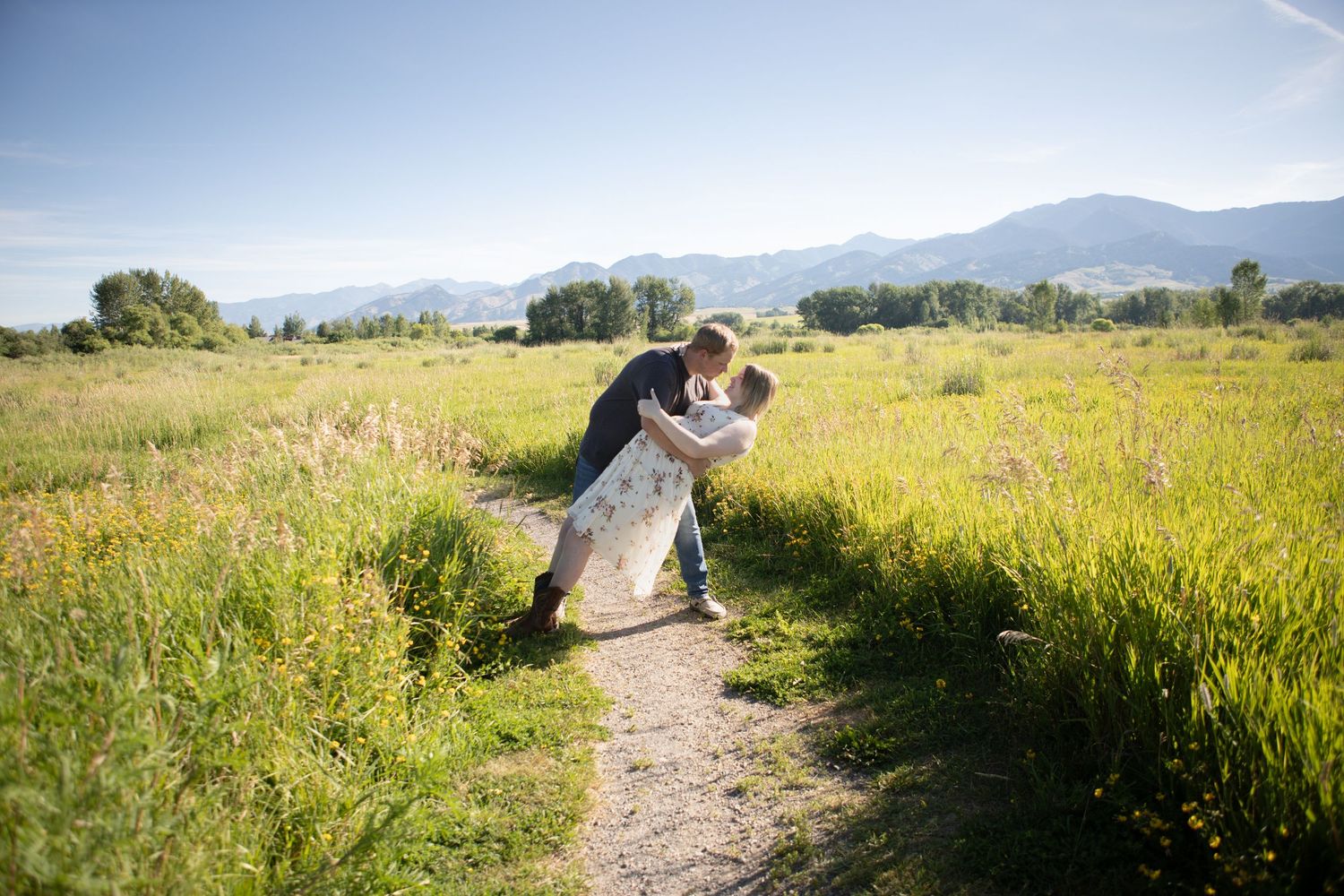Bozeman, Montana couple dancing for their maternity photos in Bozeman, Montana at Cherry River Fishing Access.