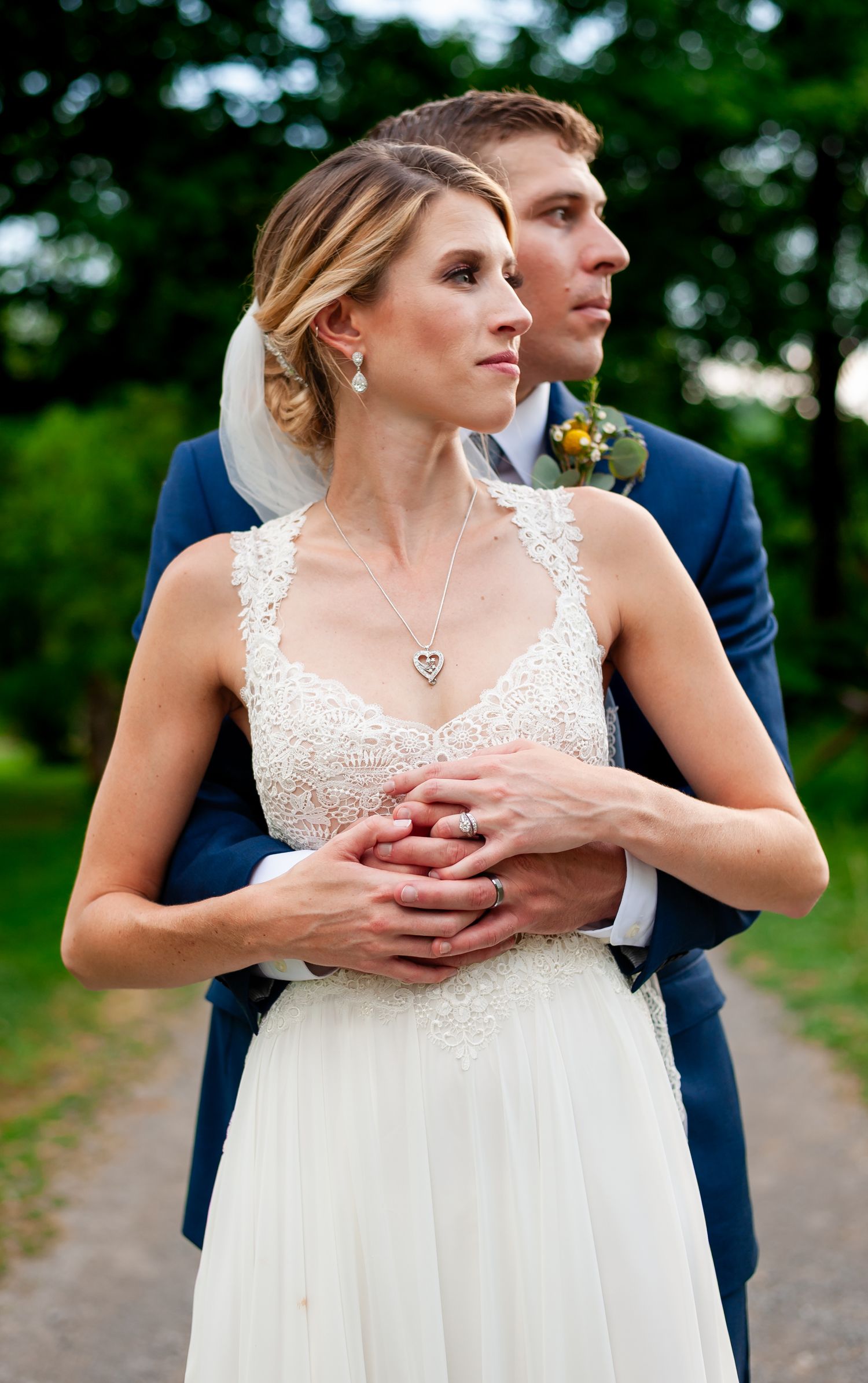 Candid emotional moment between couple during outdoor wedding photography session.