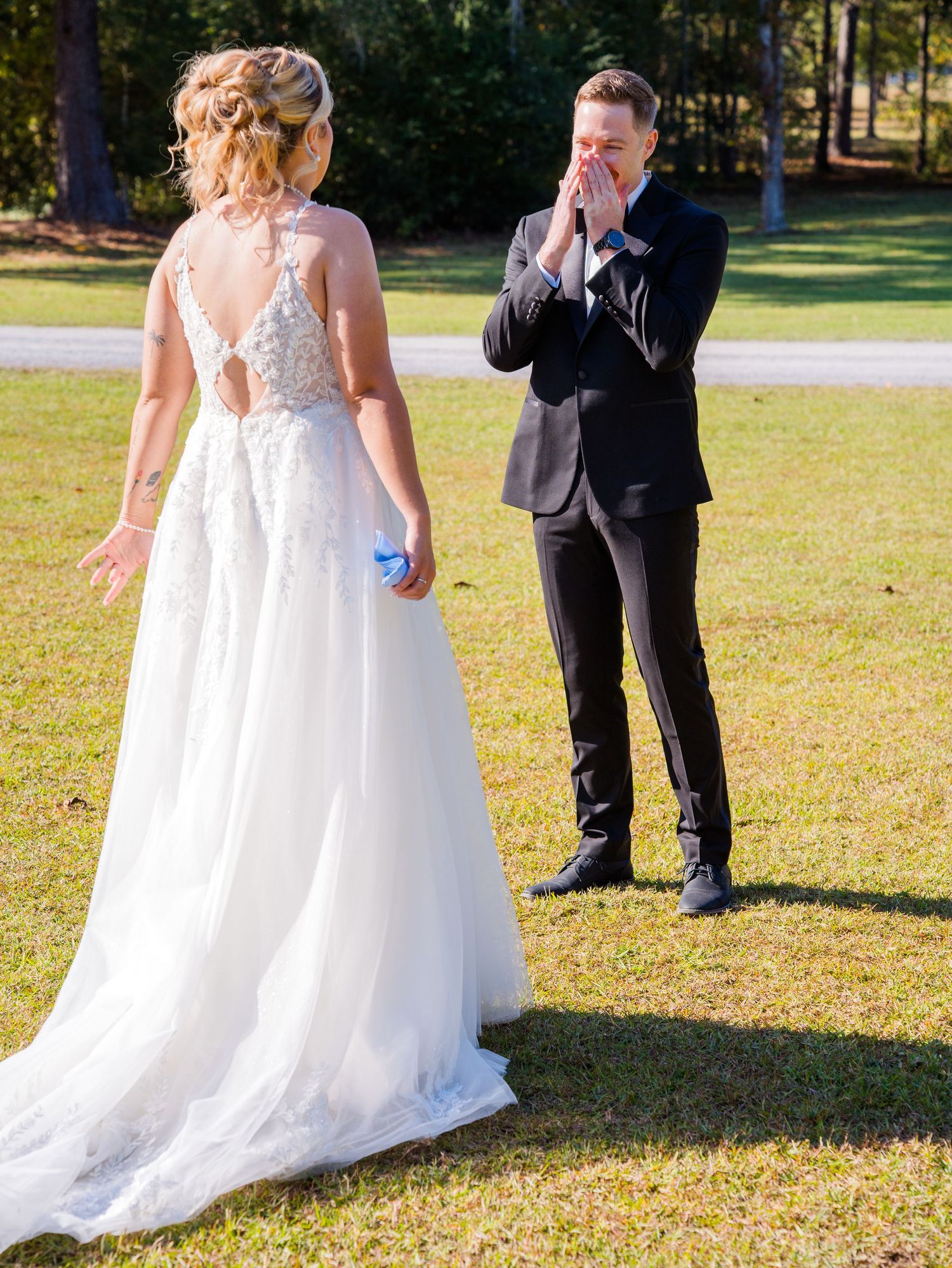A sequence of photos showing a couple in wedding attire sharing a first look moment outdoors on a sunny day.