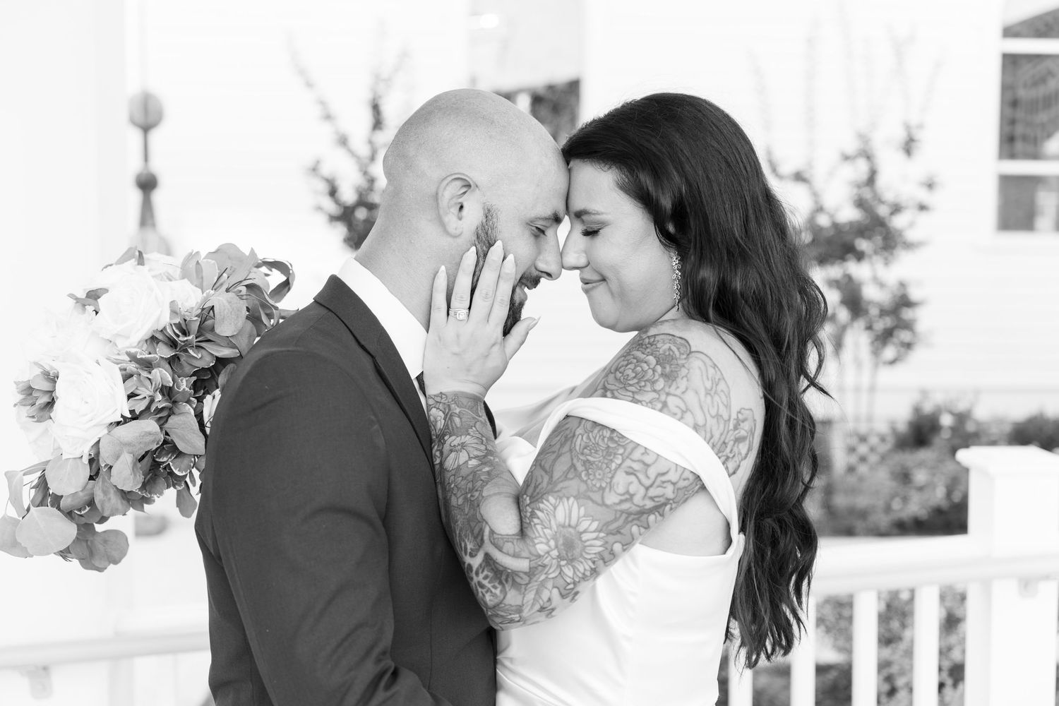 Black and white romantic wedding photos showing intimate moments.