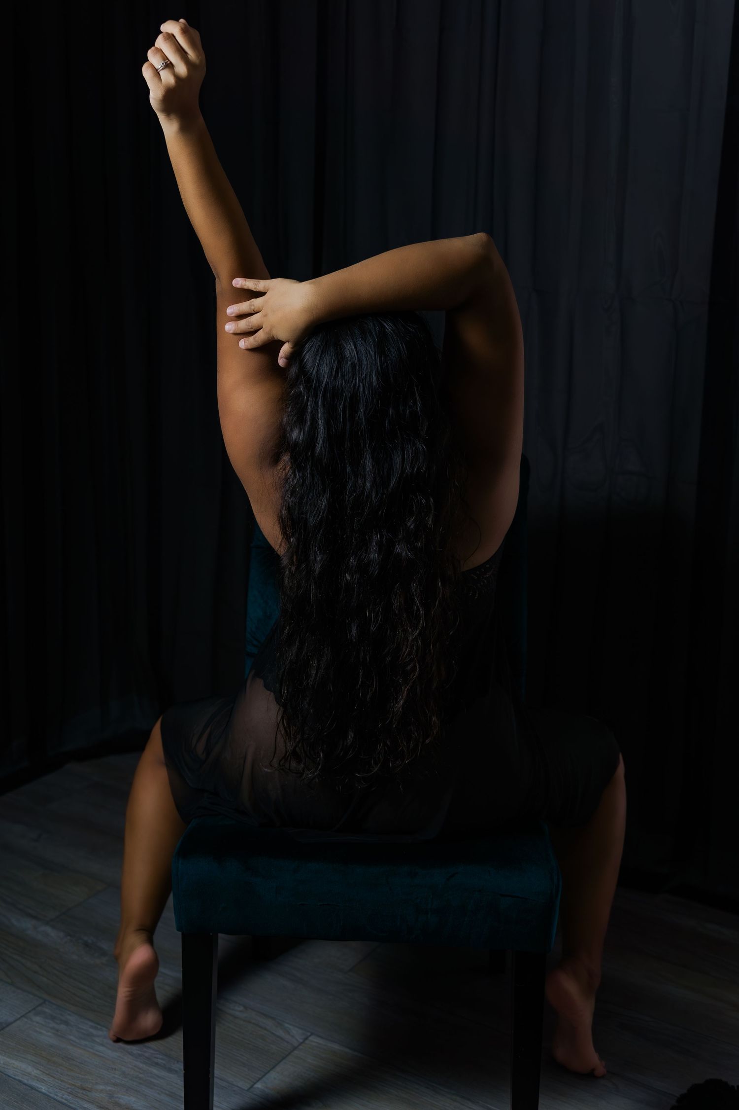 Artistic boudoir photo sequence showing silhouette against dark background.