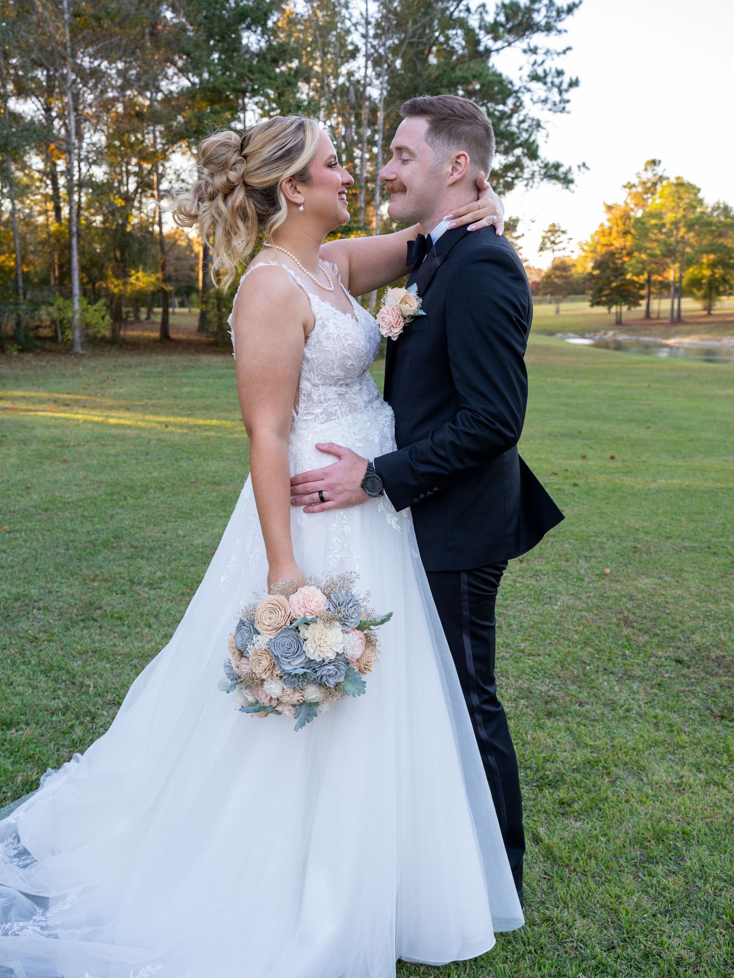 A romantic wedding couple shares tender moments in a series of outdoor photos on a grassy field at sunset.