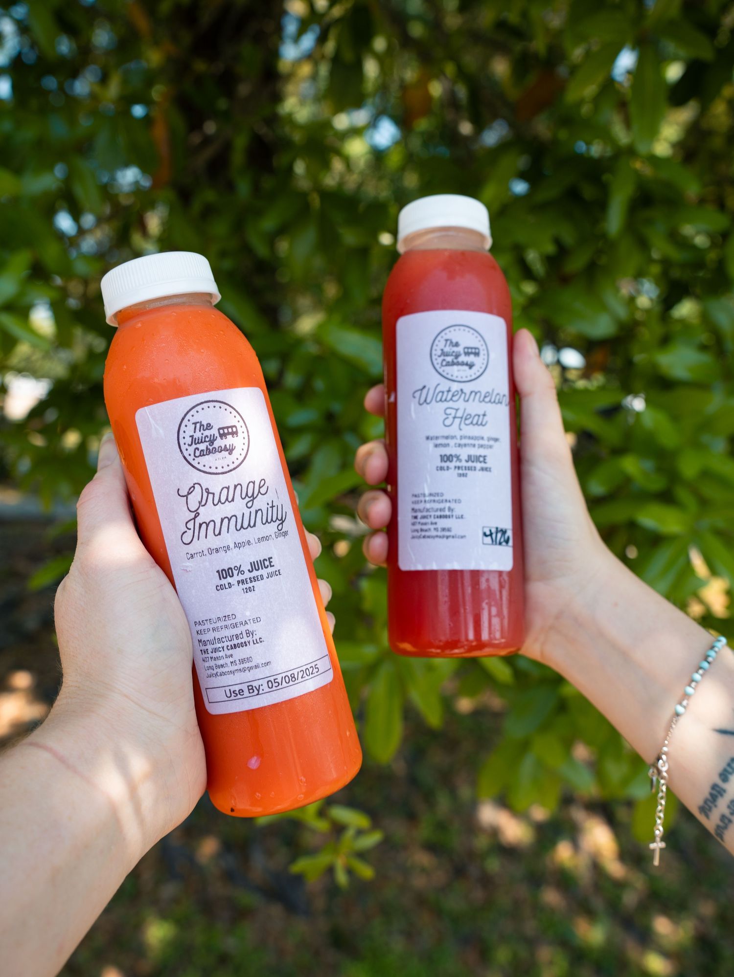 Close-up shots of colorful bottled beverages with white labels against a green leafy background.
