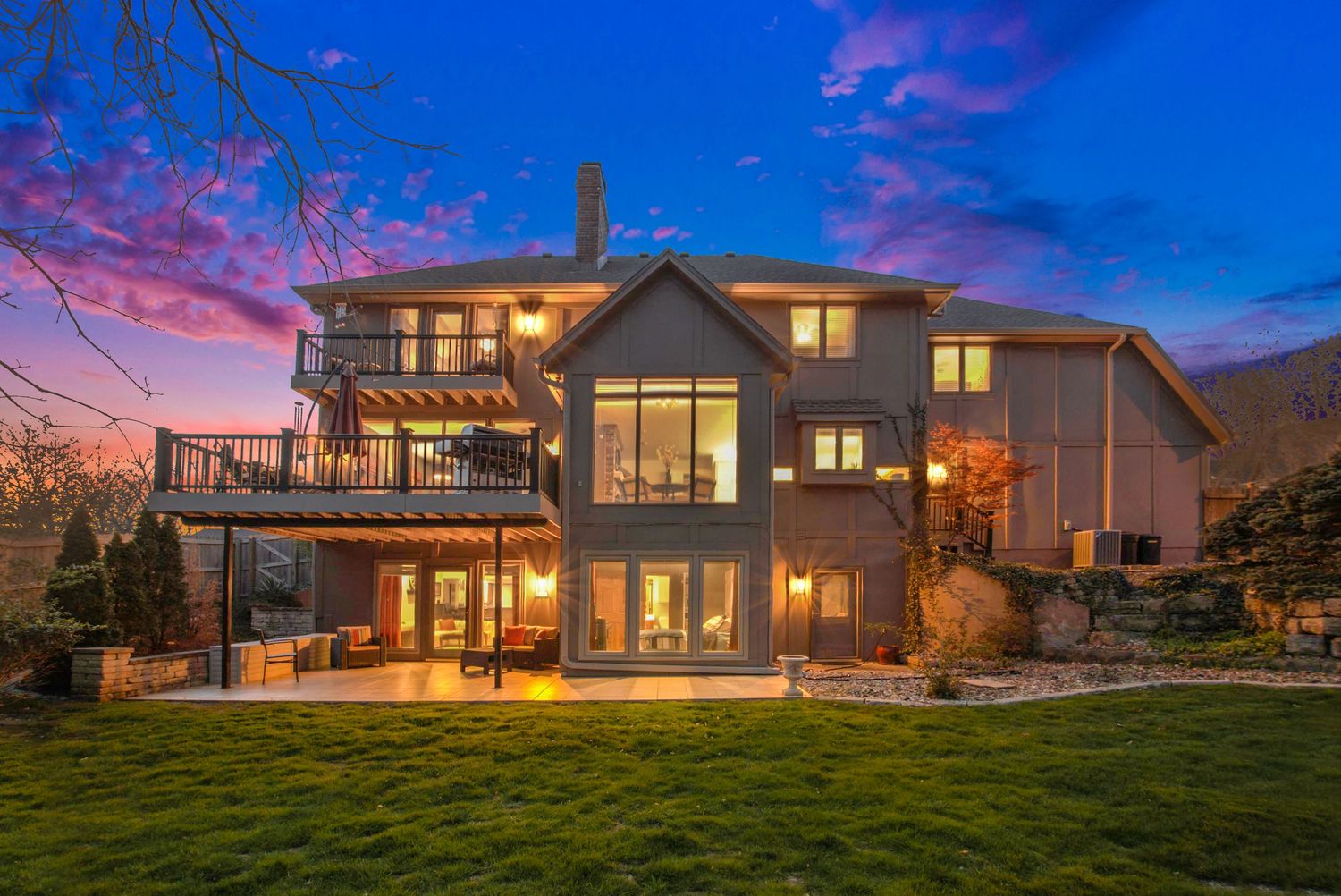 twilight photo of a large beautiful home
