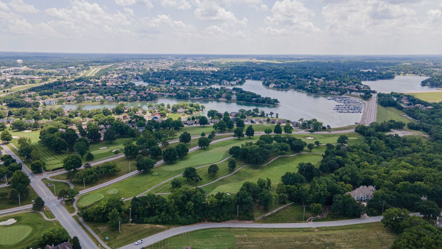 Aerial photo of a golf course with a lake