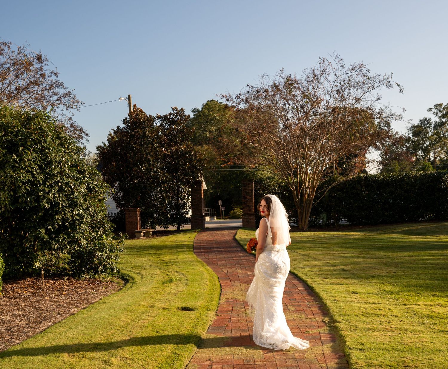 Seven connected photo frames show someone in white taking wedding photos in a sunny green park setting.