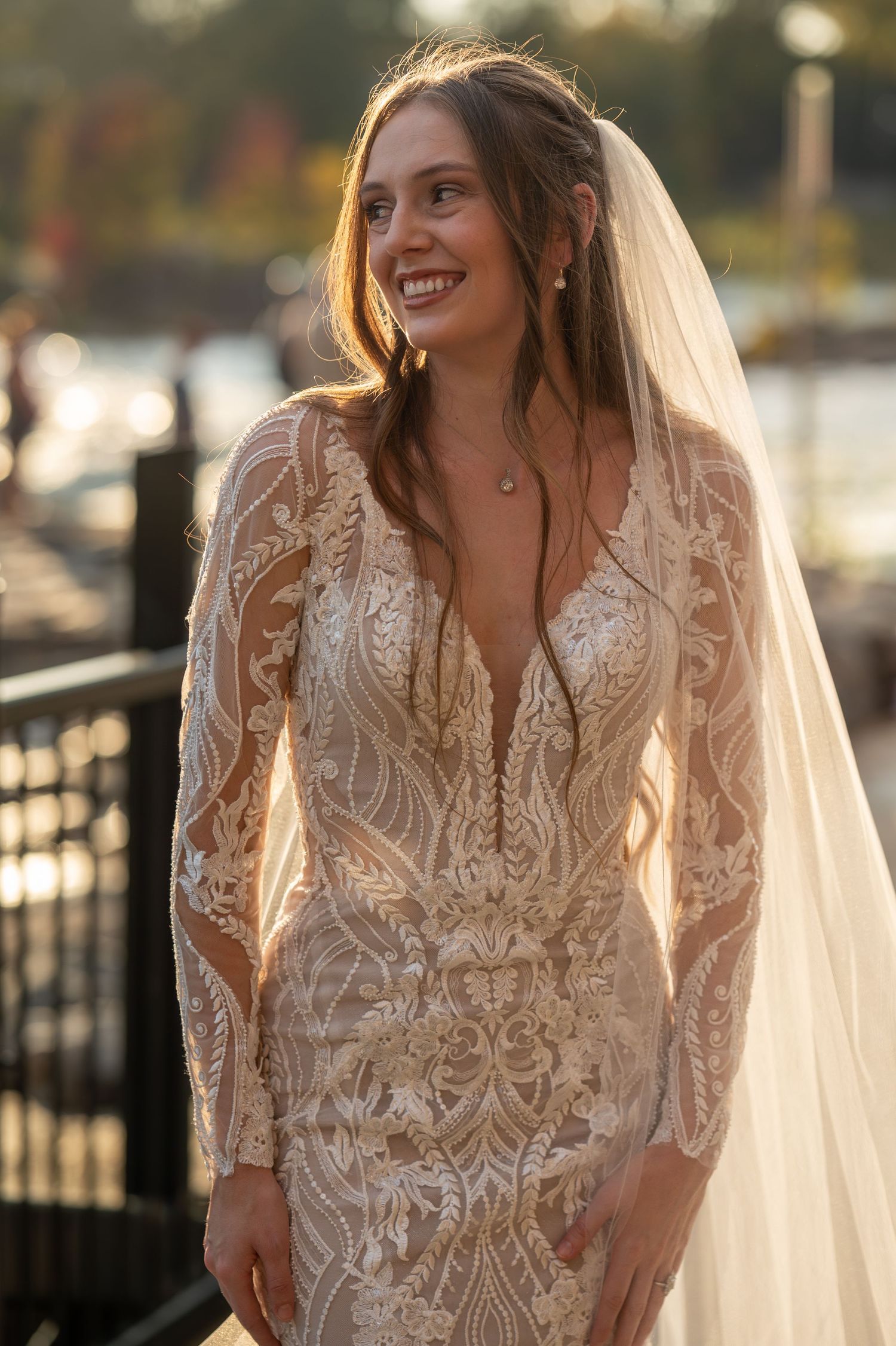 Romantic bridal portrait series featuring detailed lace gown and soft natural lighting.