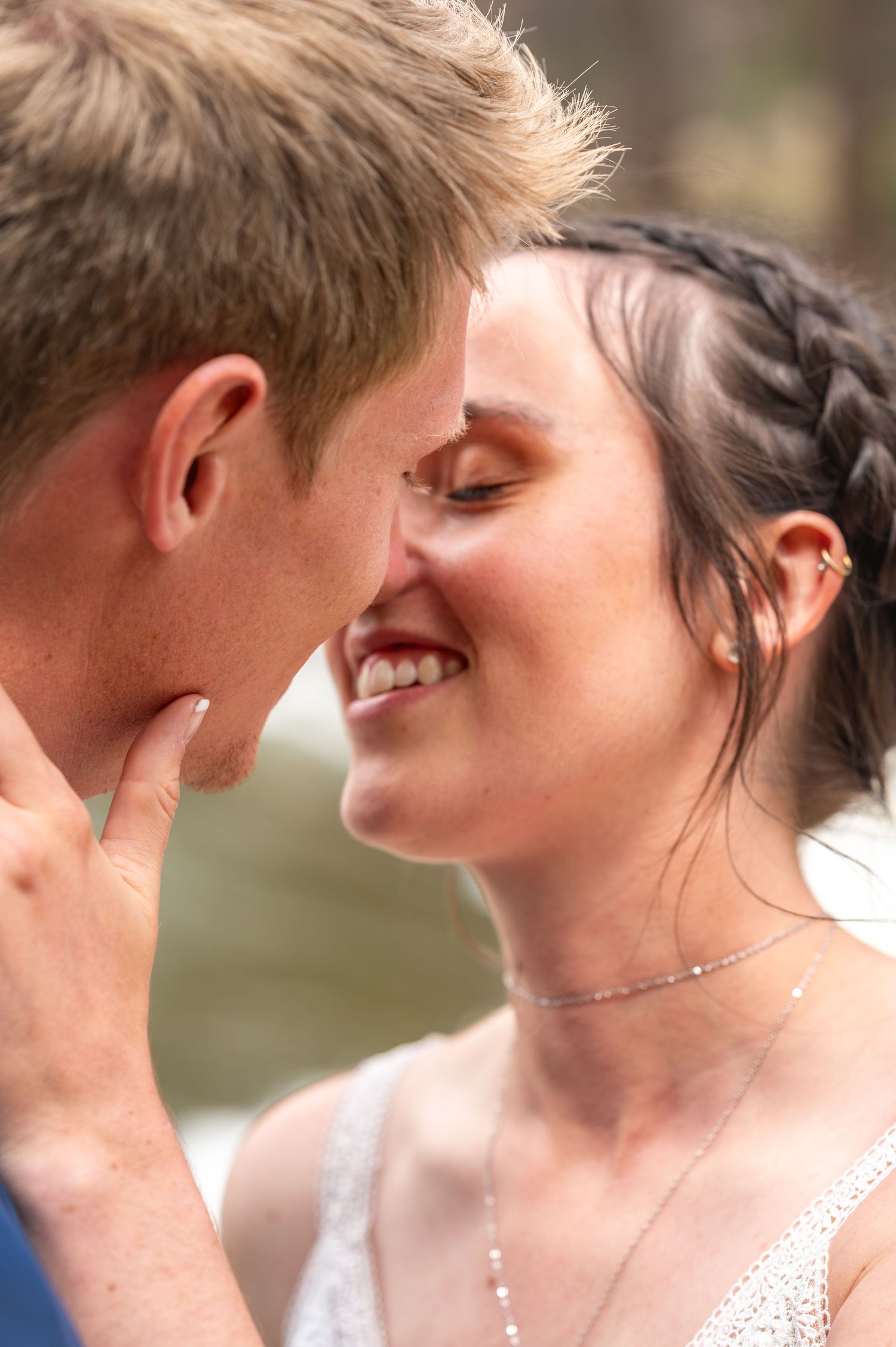 An intimate close-up moment between a couple on their wedding day.