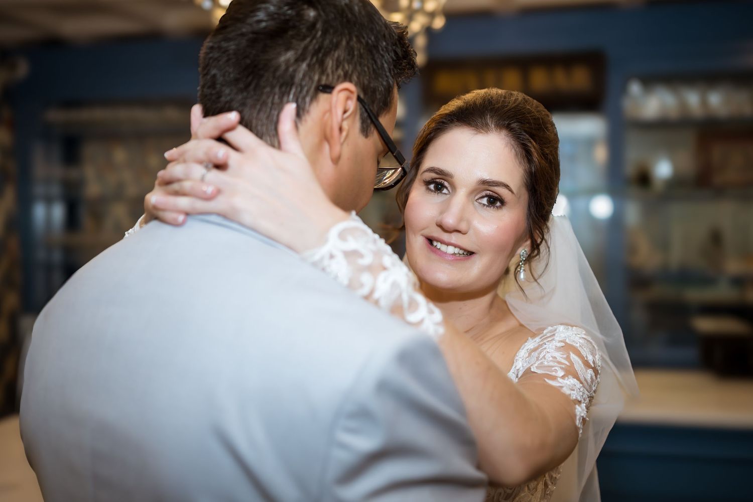 Elegant wedding reception moment captured in atmospheric indoor lighting. In the heart Columbus, Georgia historic district
