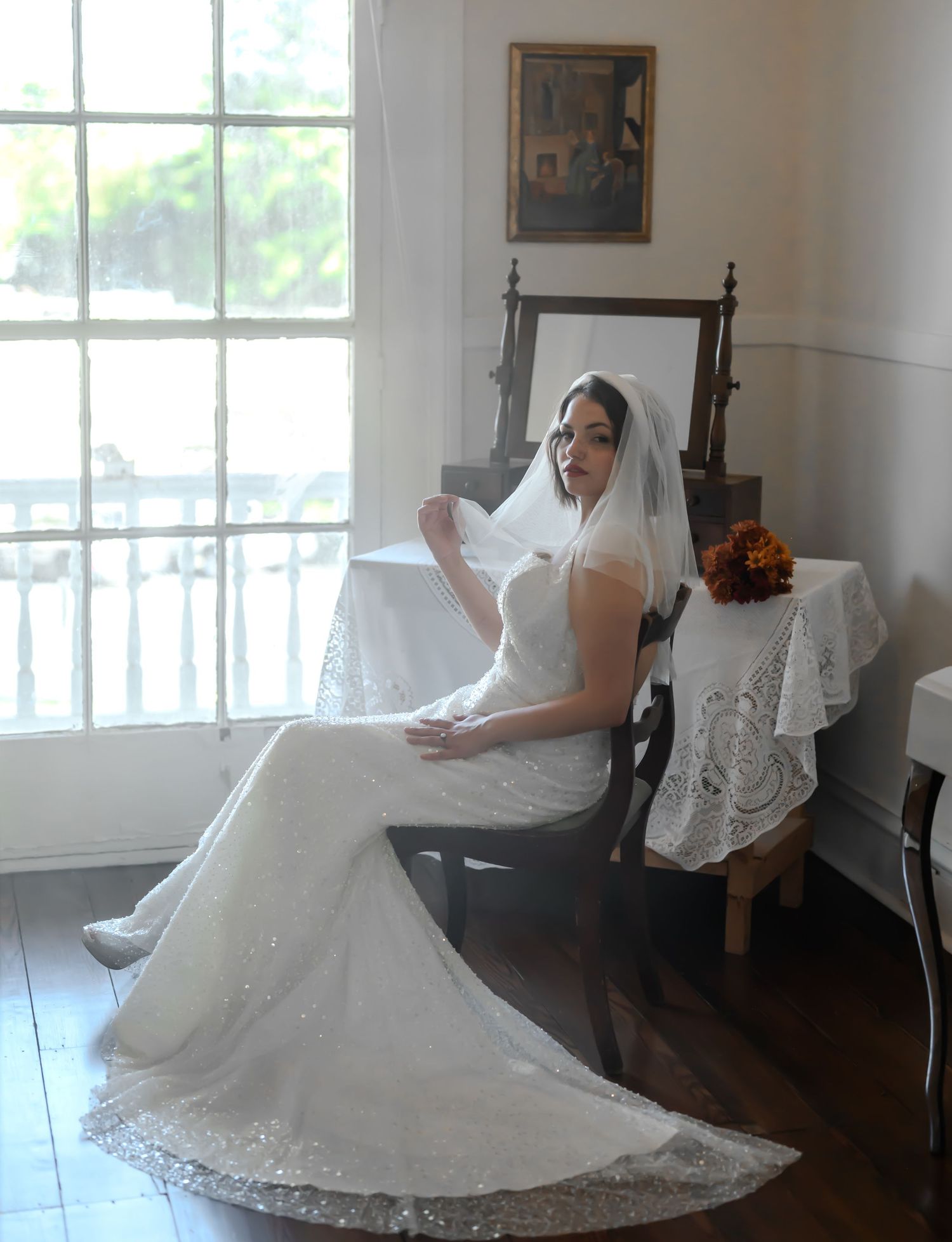 A bride in a white wedding dress twirls and spins to create a flowing circular motion effect in a bright indoor setting.