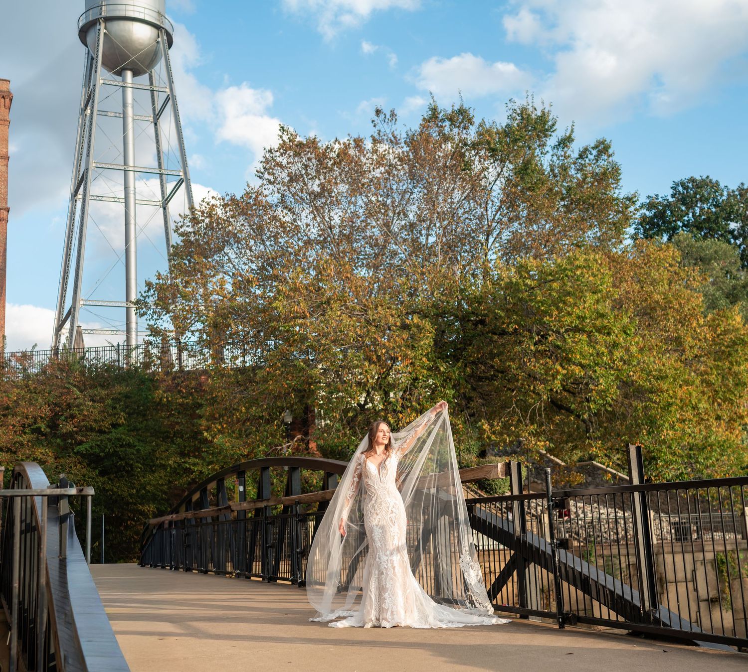 Panoramic view of a water tower and walkway during an outdoor bridal photo session.