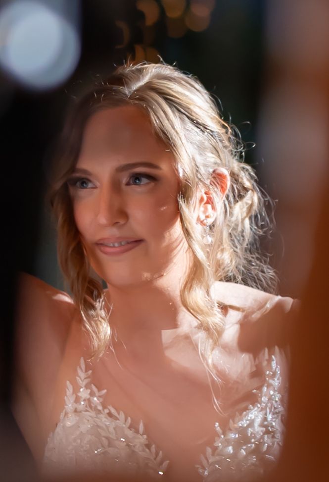 Soft focus artistic wedding photography with warm glowing lighting.