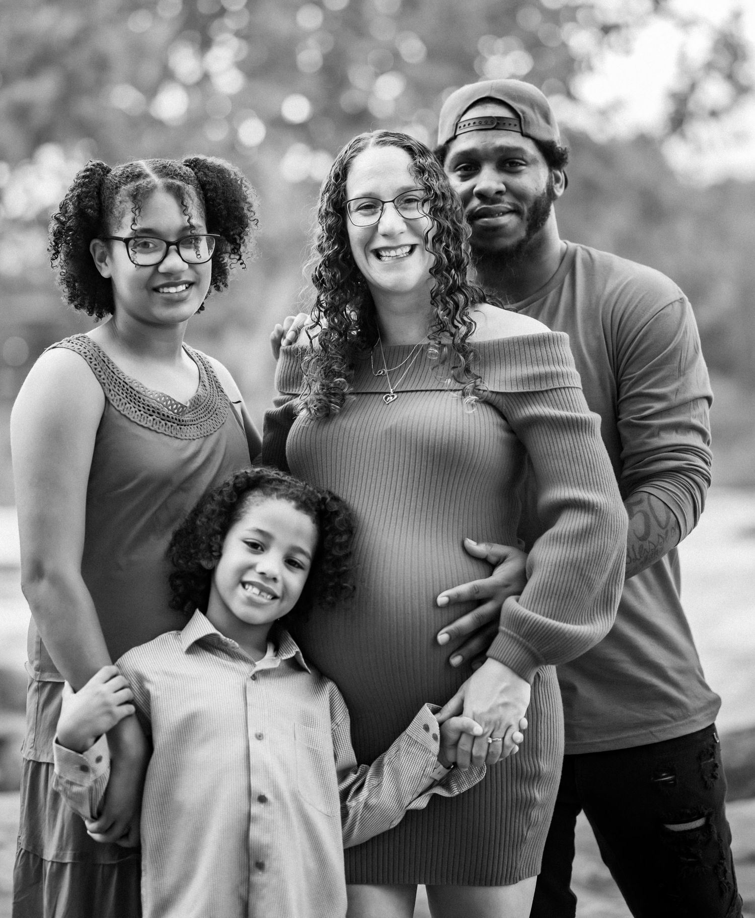 A family wearing coordinated outfits poses together outdoors in a series of candid moments.