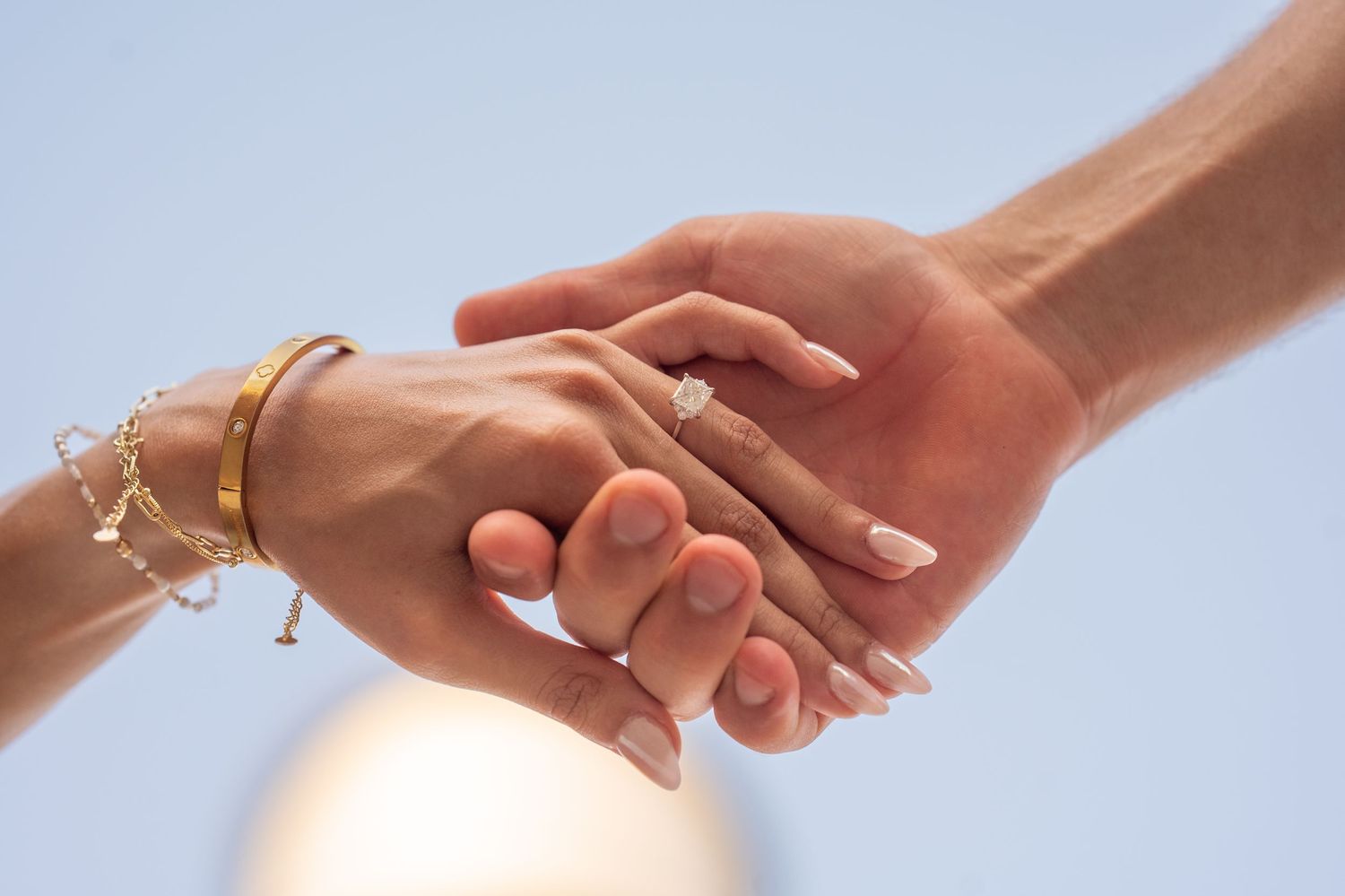Multiple photographs showing close-up shots of hands in engagement and wedding ring proposal moments.
