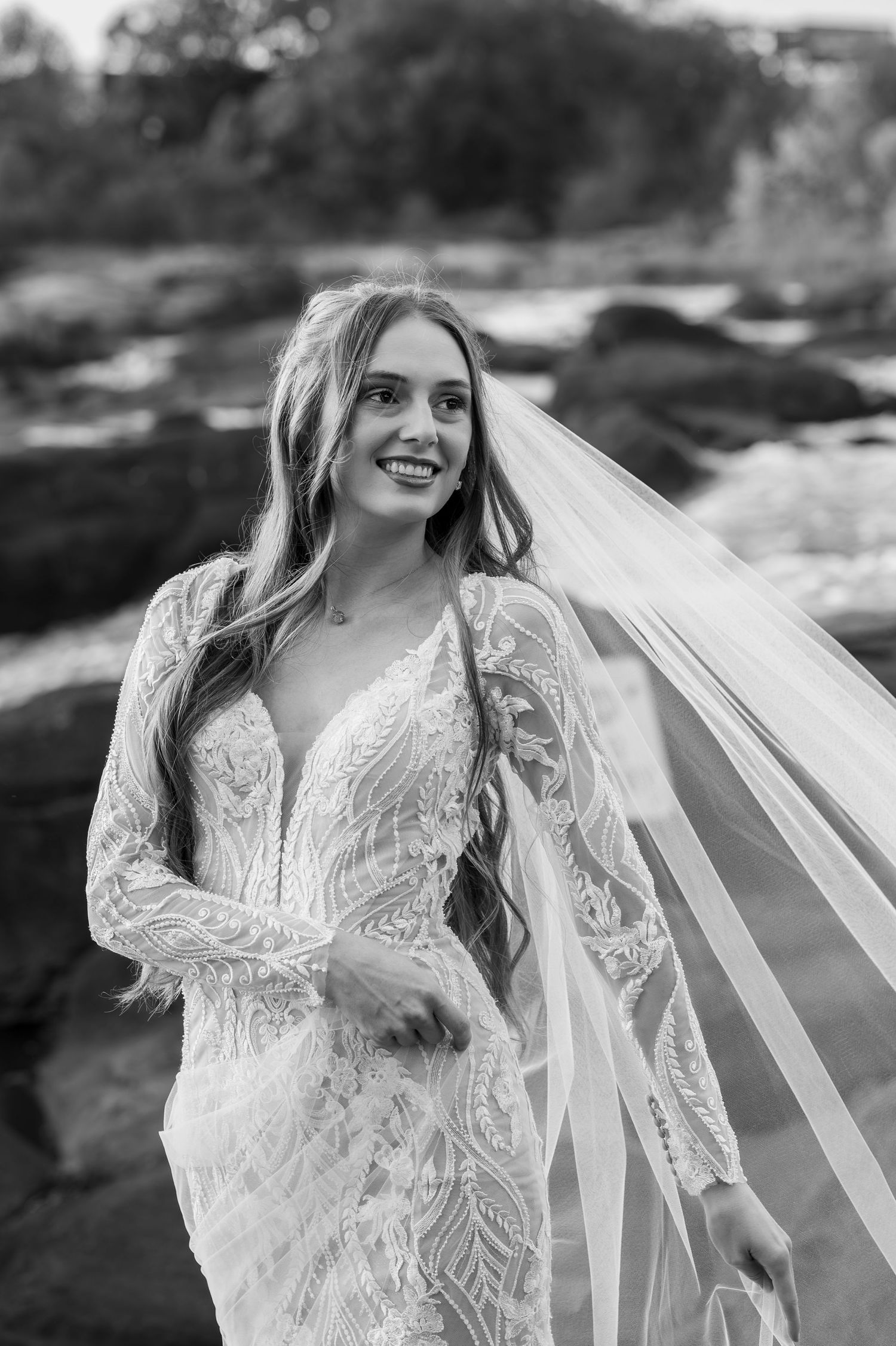 Black and white series of bridal portraits featuring an intricate lace gown with flowing veil.