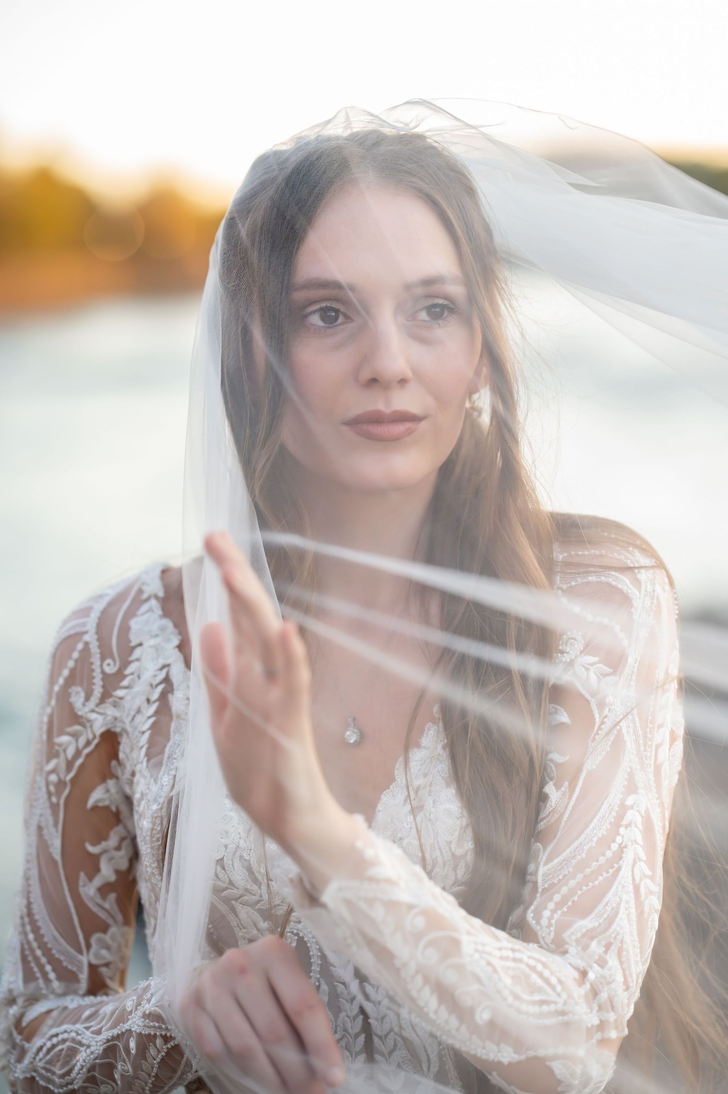 Ethereal close-up bridal portraits with delicate veil details in soft lighting.