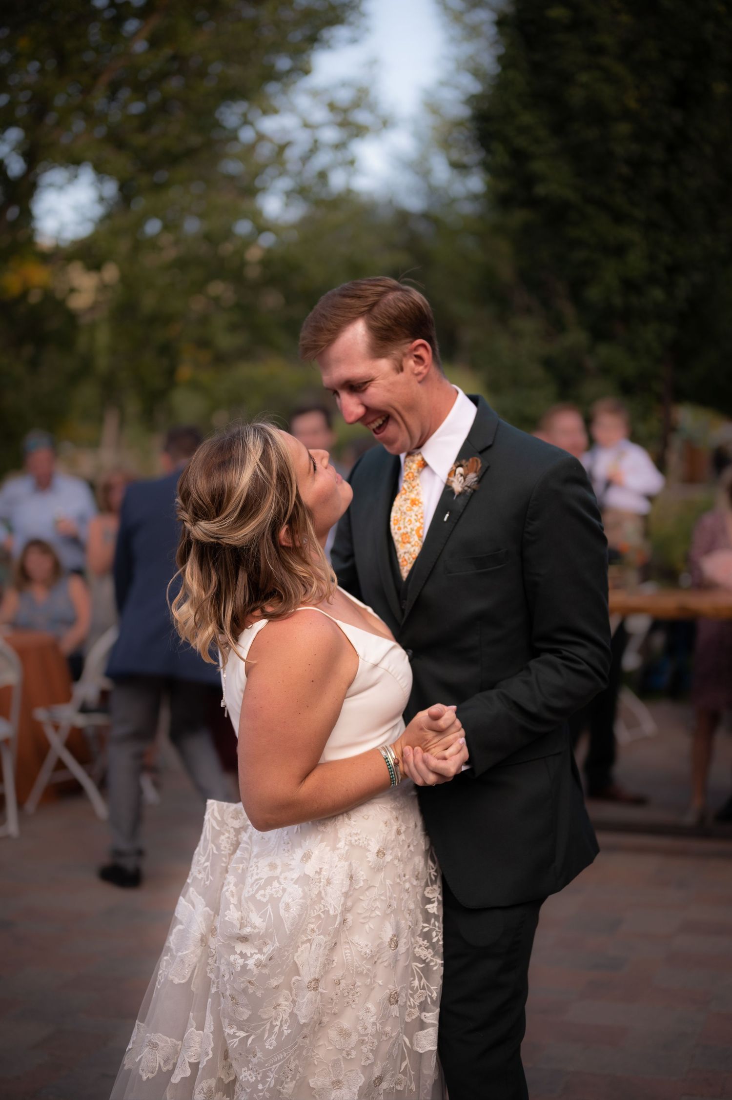 A couple shares an intimate dance moment at their wedding reception.