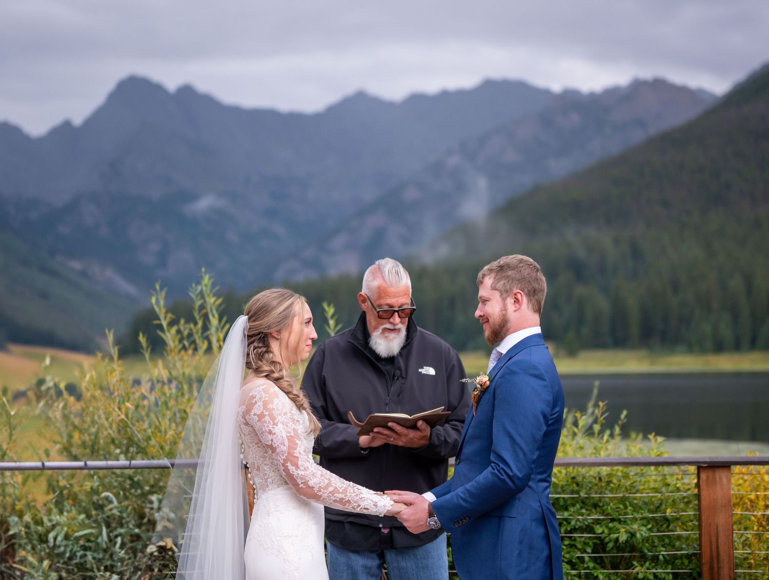 Mountain landscape provides a stunning backdrop for an intimate wedding ceremony at Piney River Ranch in Colorado.