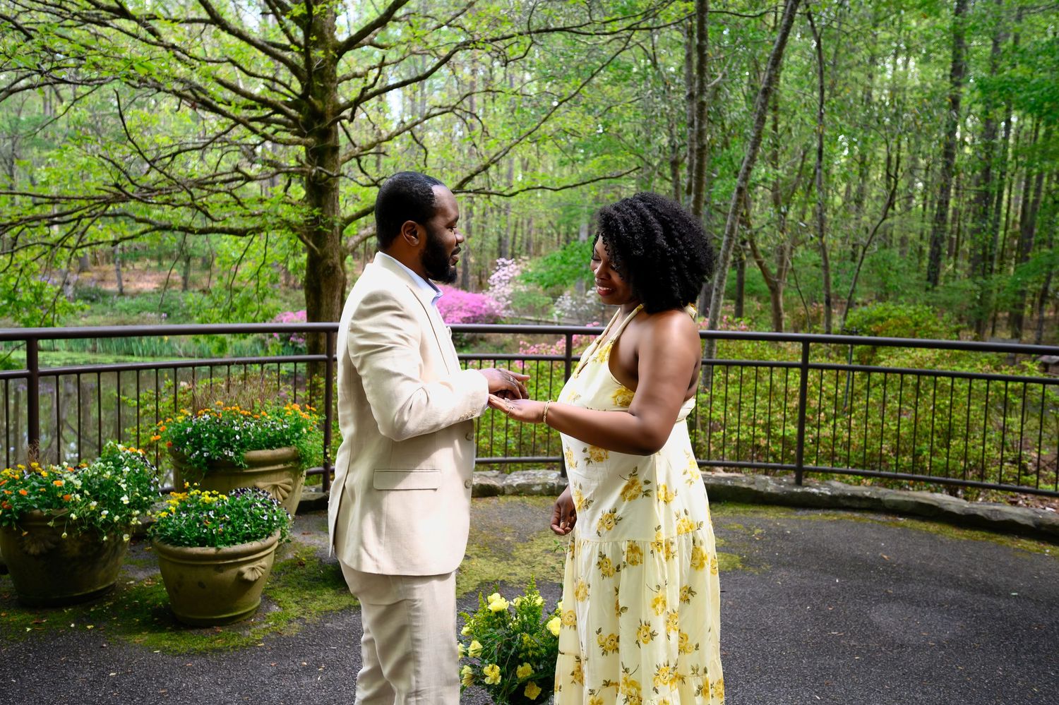 African American couple sharing an intimate moment on a rainy day outdoor terrace in coordinating outfits.