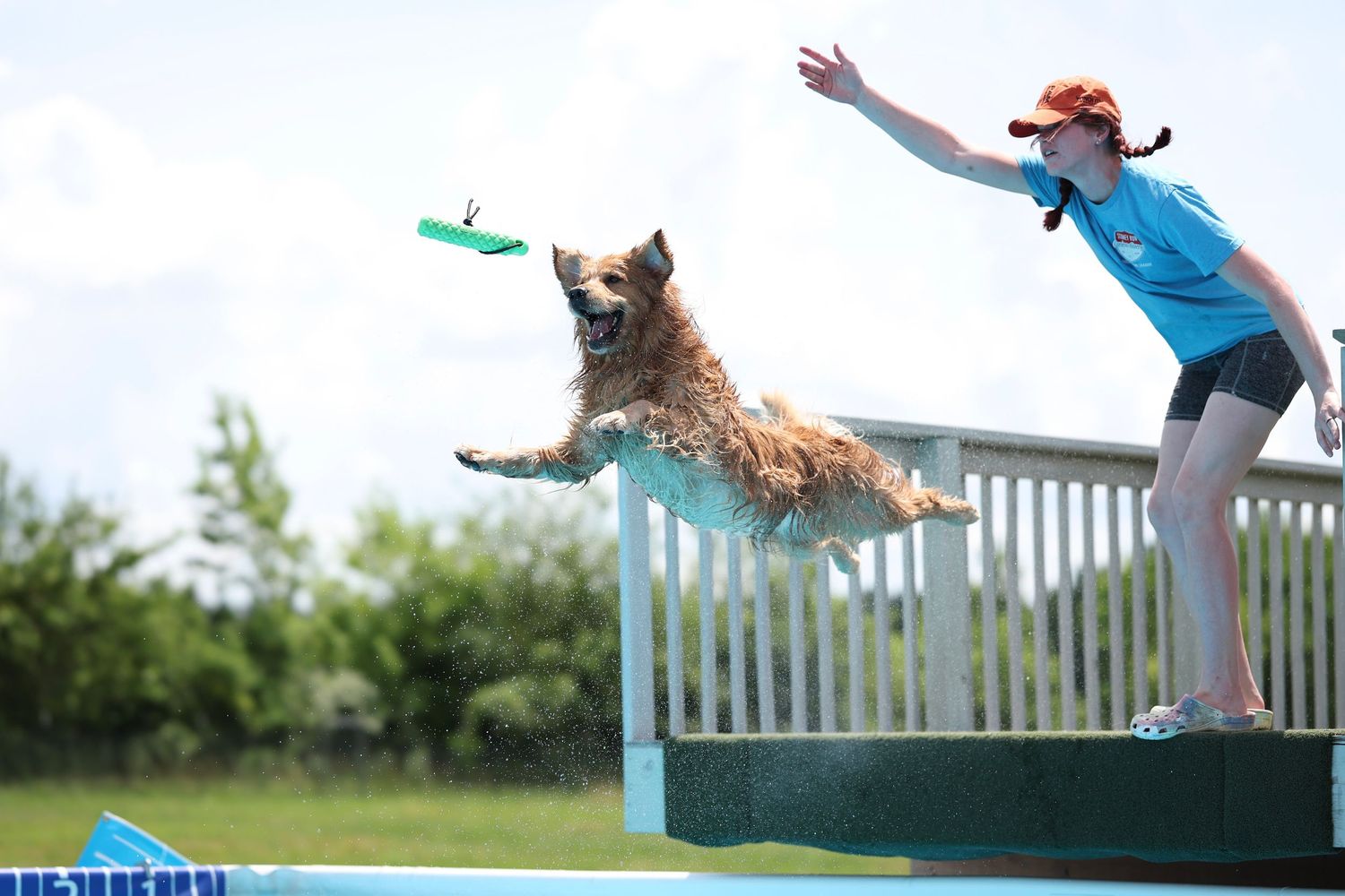 A sequence of action shots showing a person jumping over a white fence in a grassy outdoor setting.