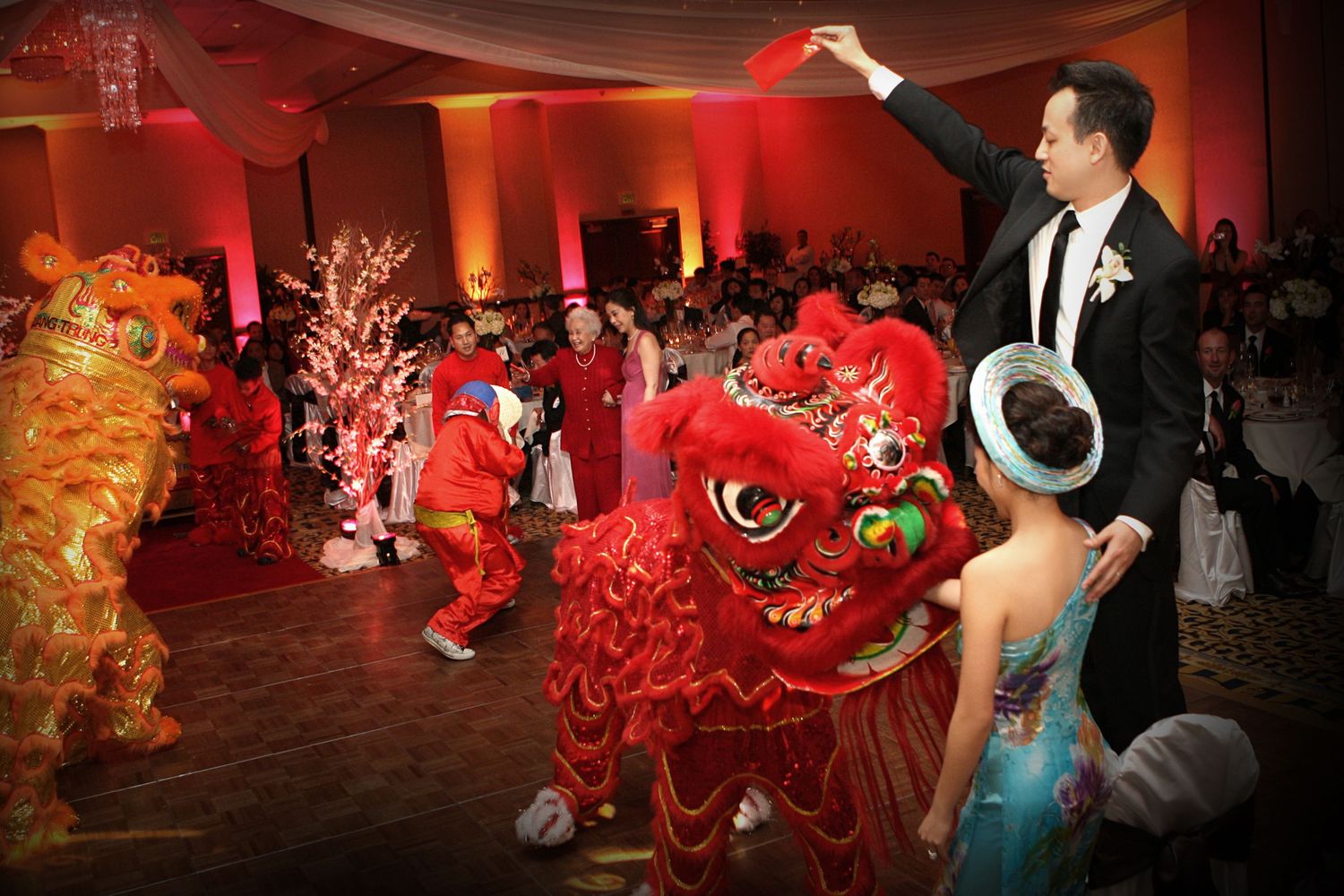 Dance party scene with red lighting and energetic crowd enjoying festivities.