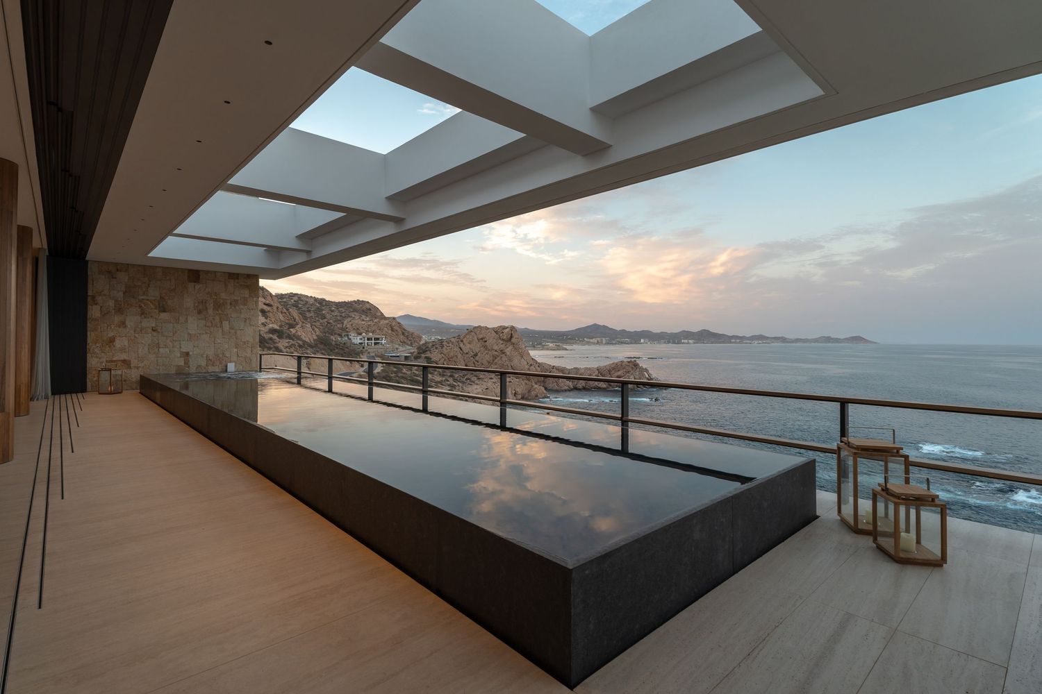 Contemporary luxury home in Los Cabos featuring minimalist design, natural stone, and desert landscaping