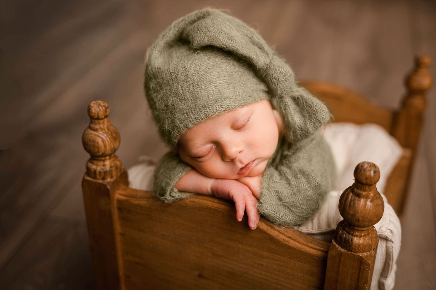 Newborn in studio on bed