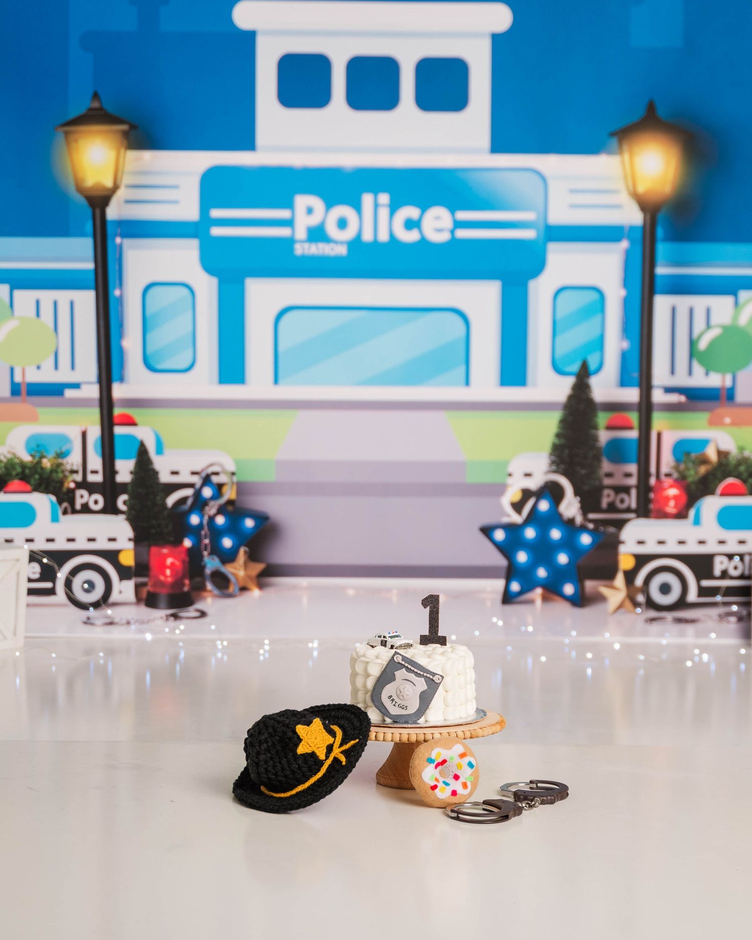 Miniature police station setup for Rookie of the Year cake smash.