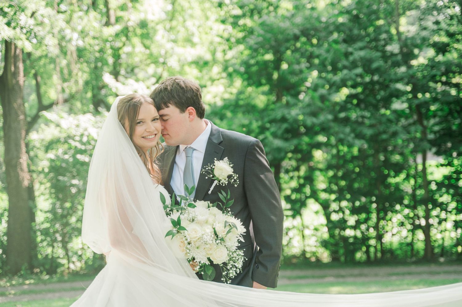 Intimate wedding portraits captured in a serene garden setting.