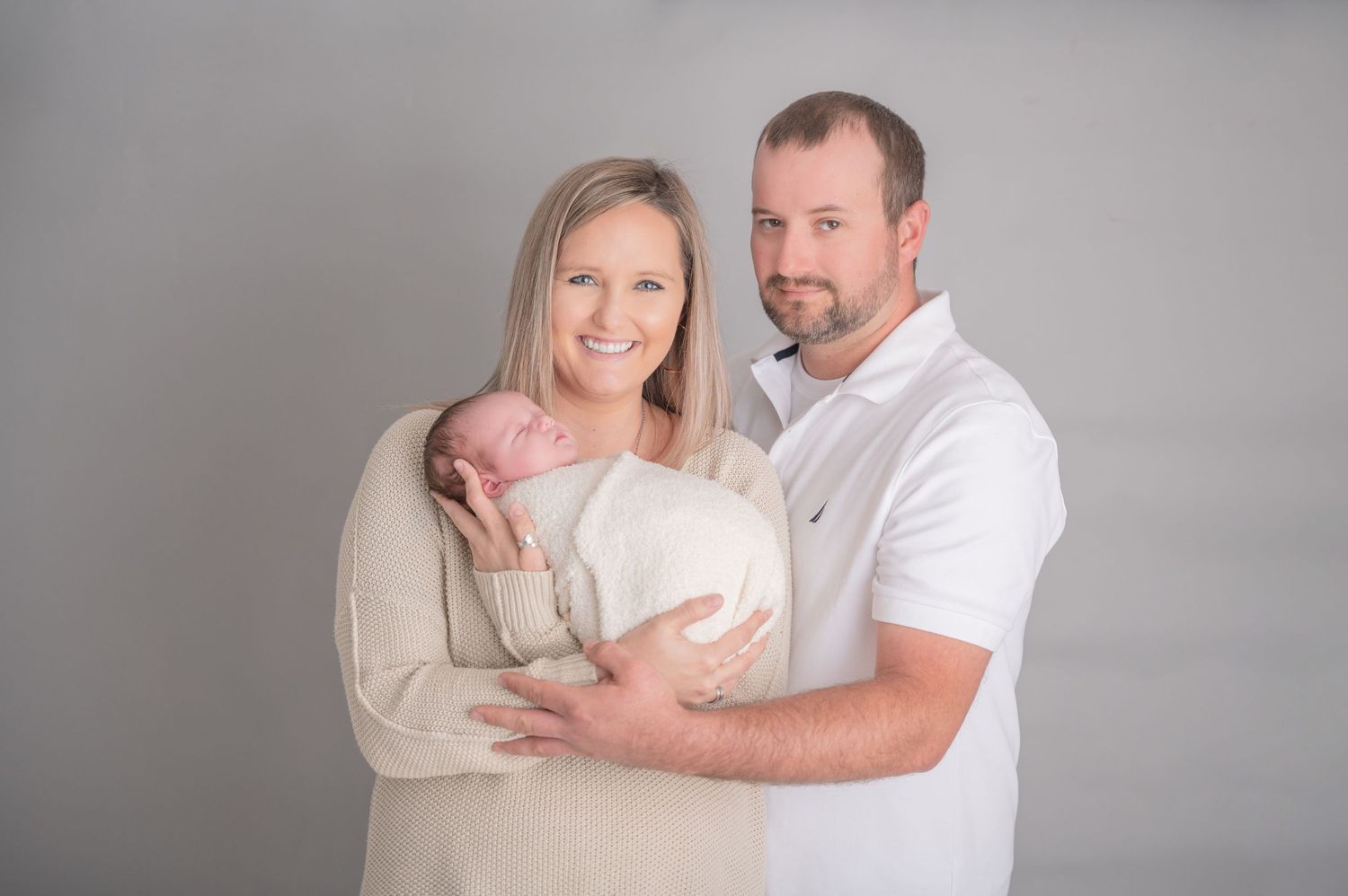 parents and newborn in studio