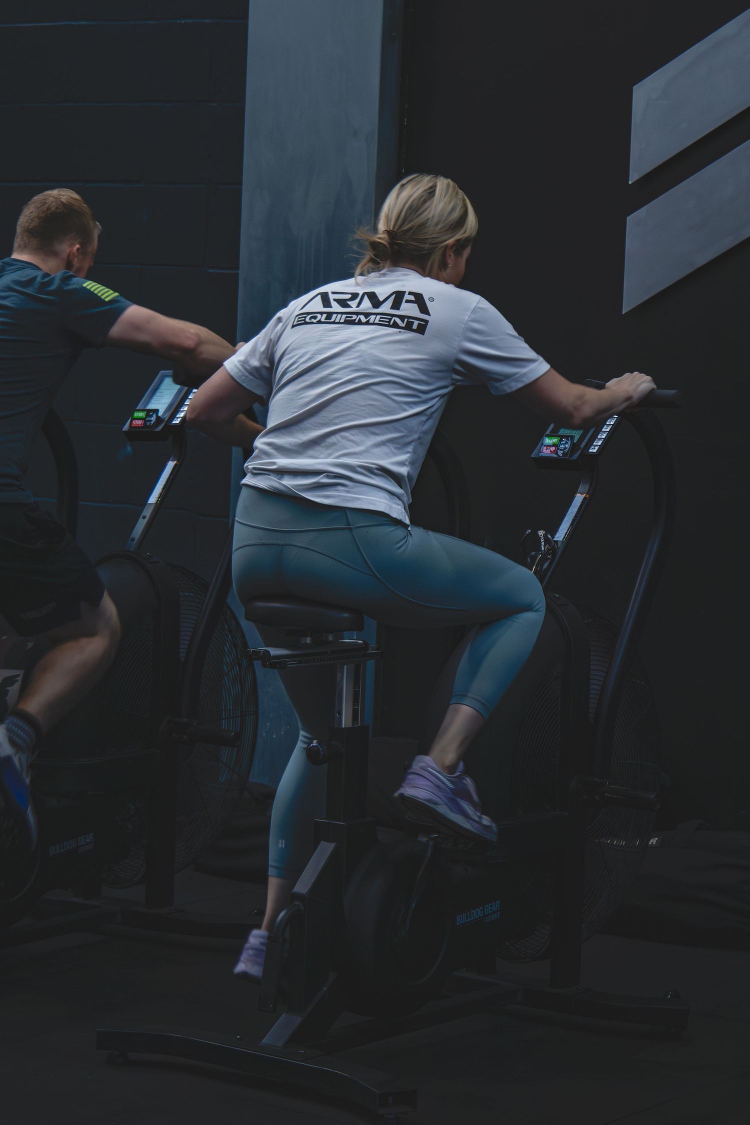 Time lapse series of person in workout clothes climbing stairs in a dimly lit environment.