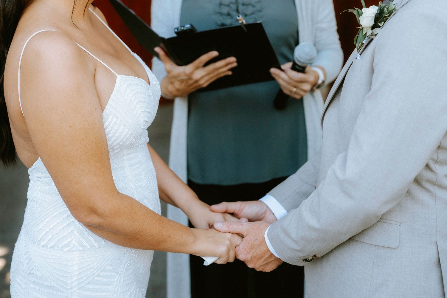 Close-up details of a couple during their wedding ceremony.