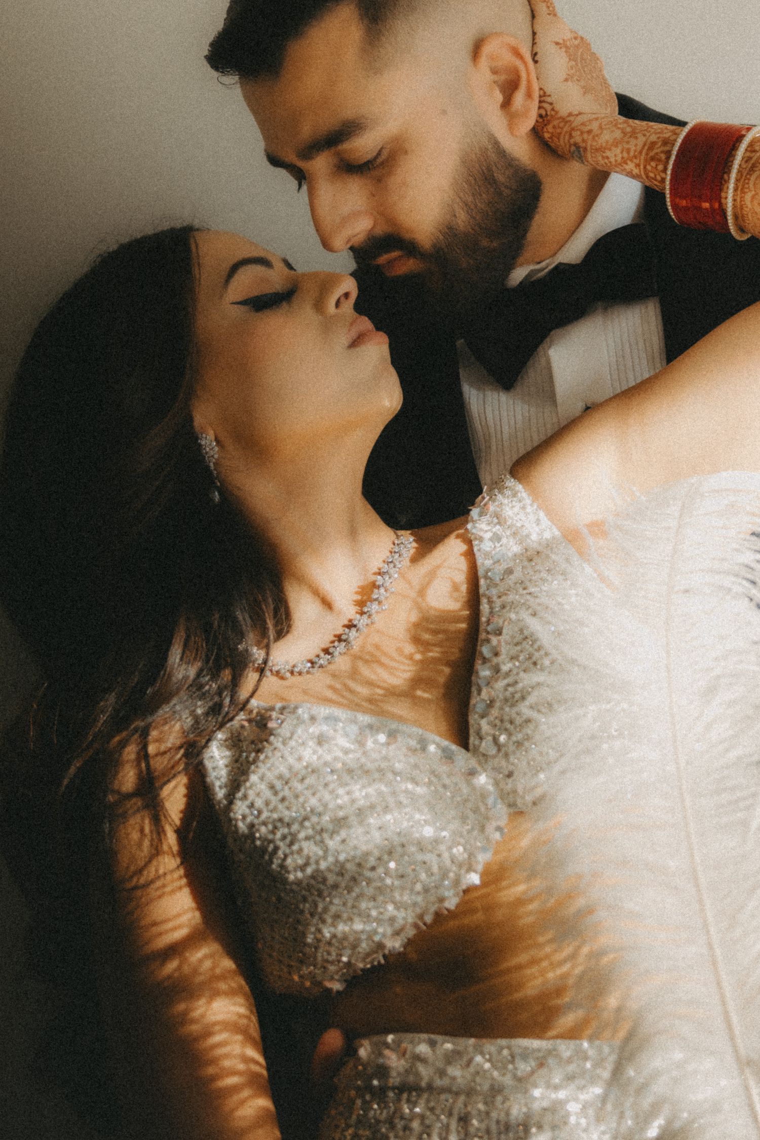 A romantic sequence of wedding photos showing intimate moments between newlyweds in elegant attire.