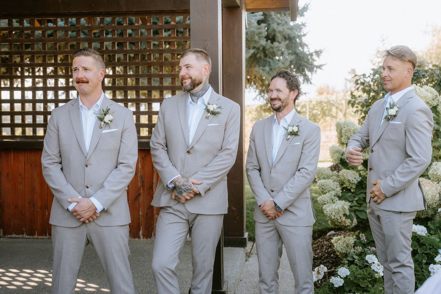 A series of wedding party photos showing groomsmen in light gray suits posing together outdoors.