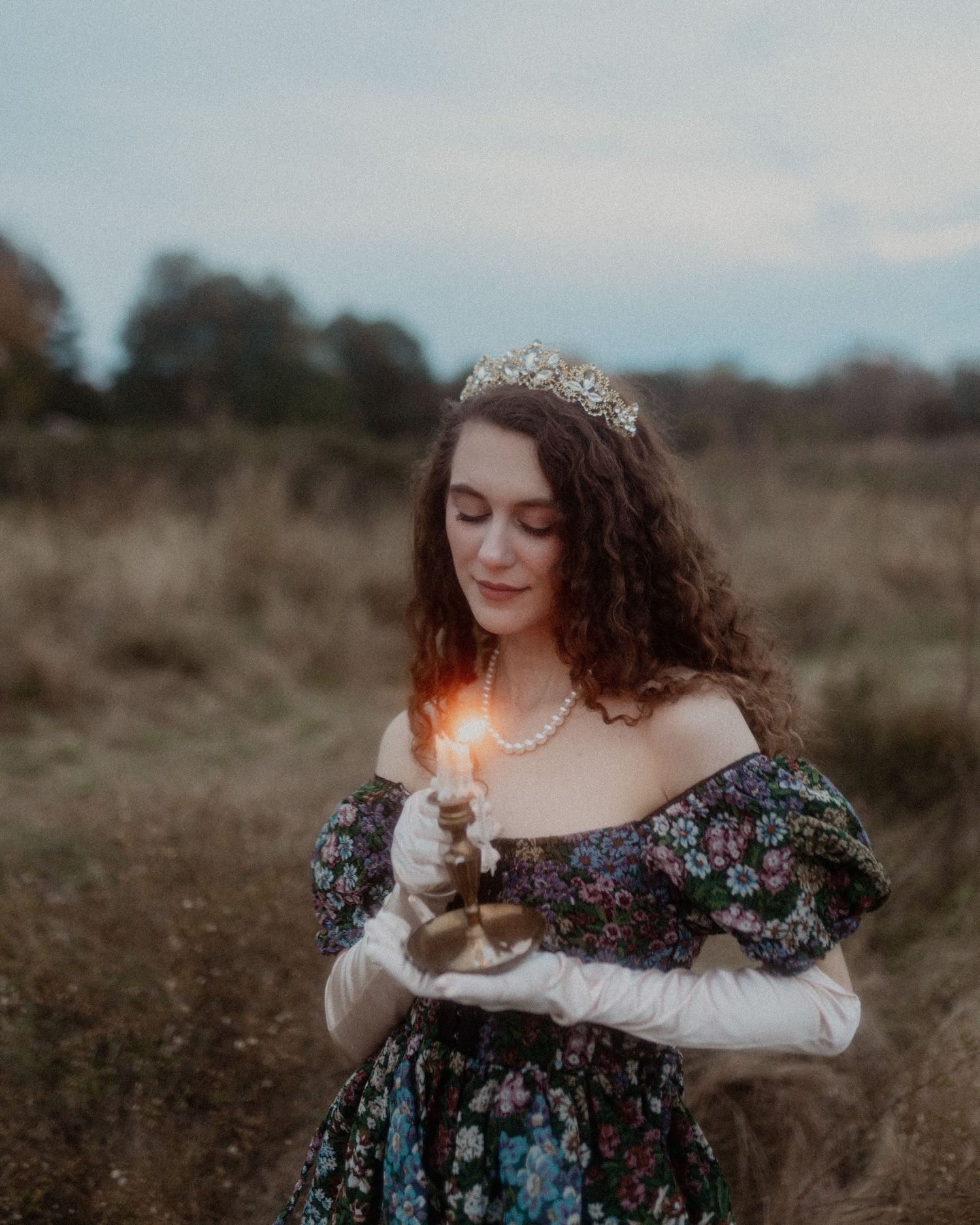 A romantic portrait with sparklers and baby's breath flowers at dusk.