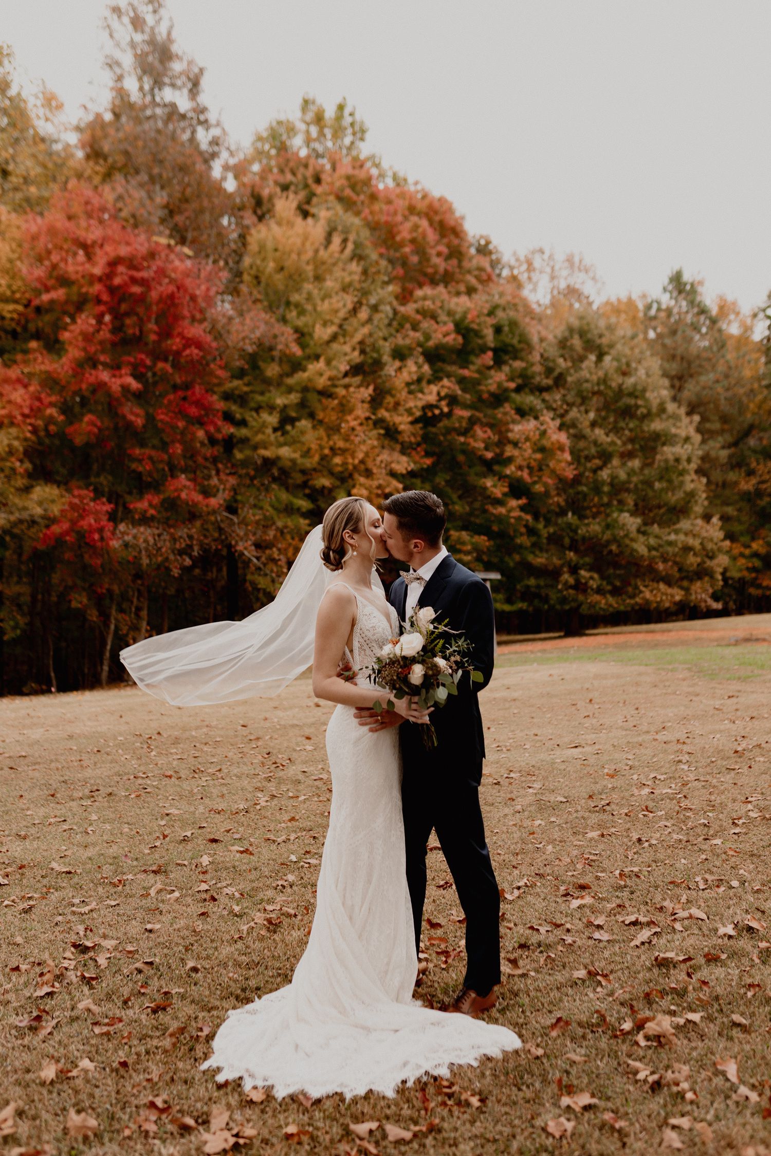 A romantic wedding photo sequence showing a couple dancing in a fall meadow.
