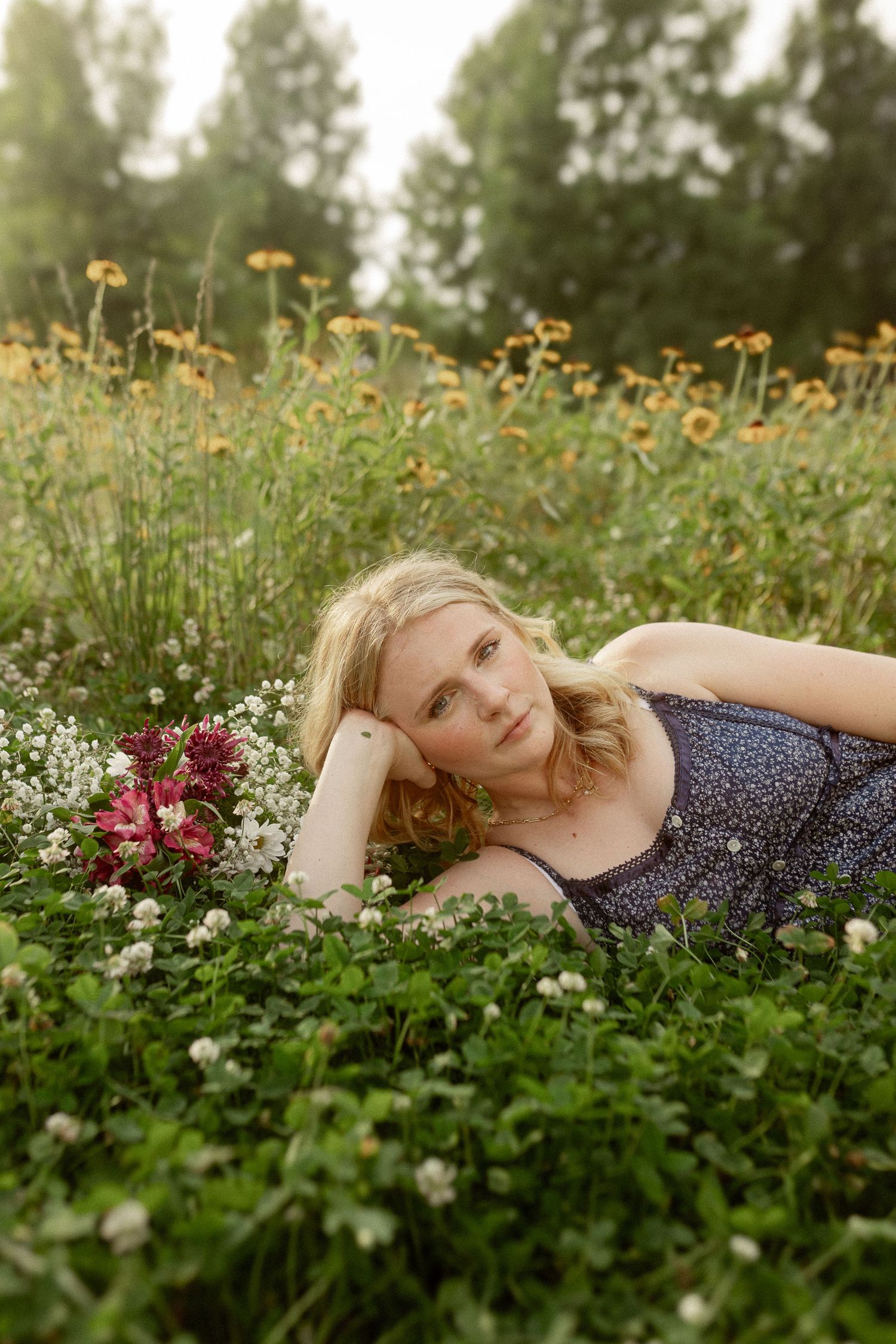 Summer portrait in blooming wildflower meadow with yellow and white flowers.