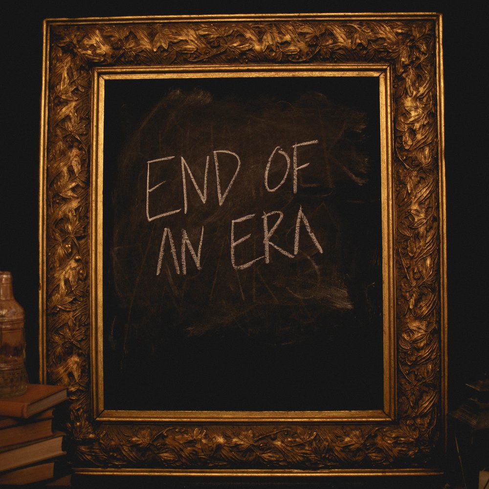 A series of ornate gold frames with black chalkboards displaying different text written in chalk.