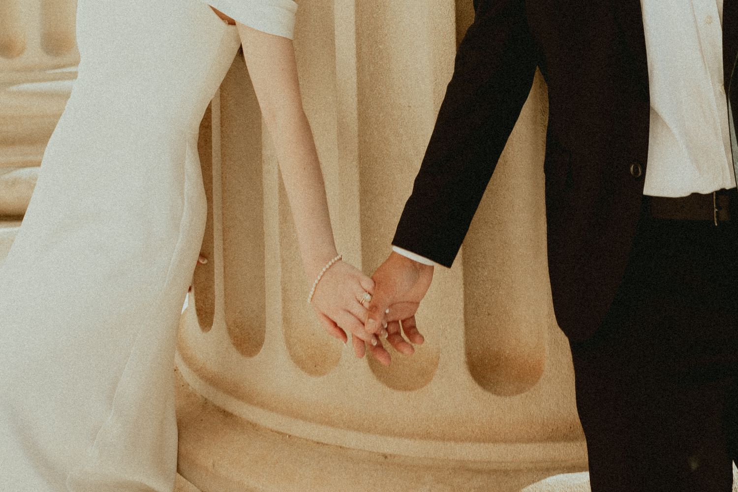 Detail shots of formal attire and feet at a wedding ceremony.