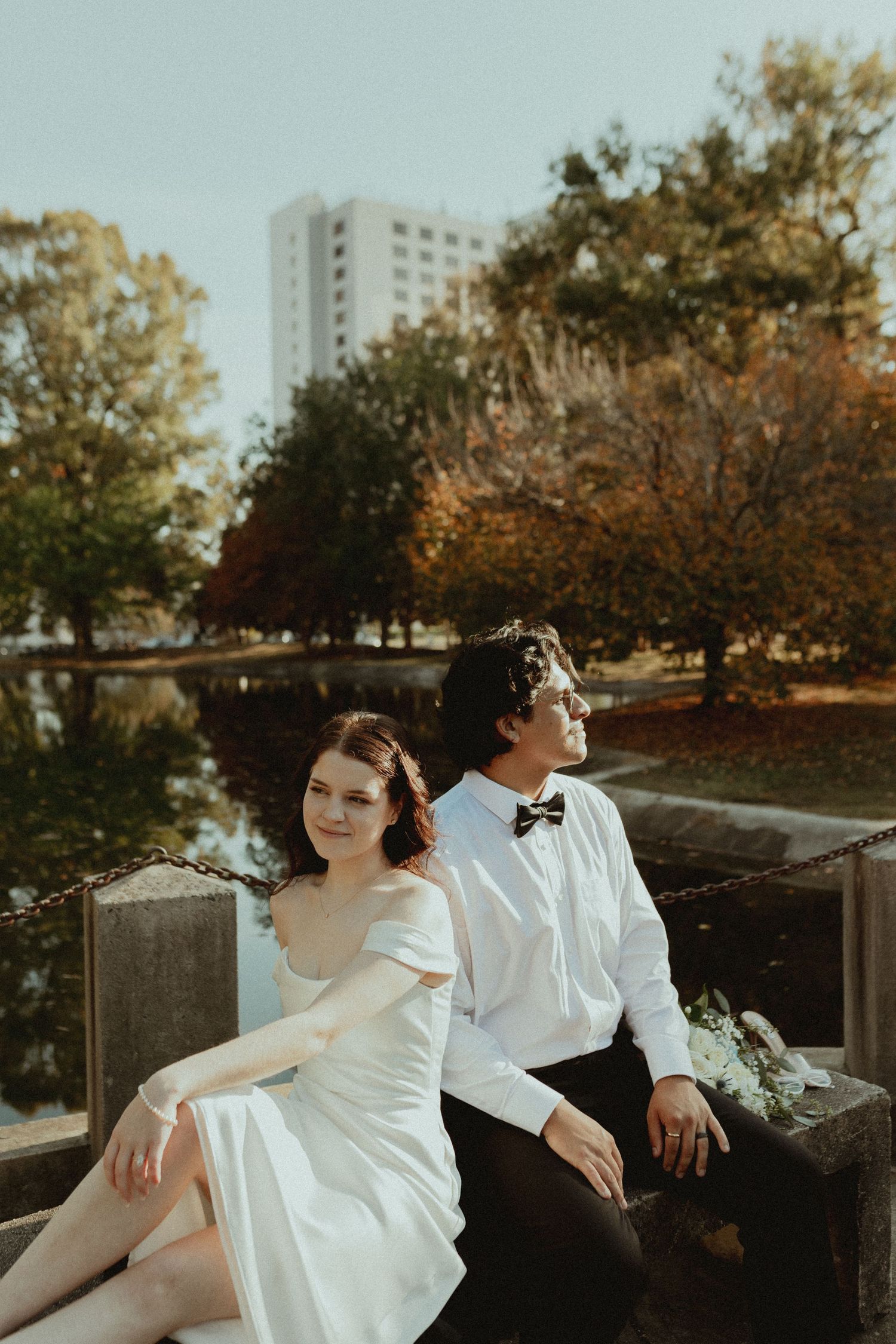 Artistic wedding photoshoot sequence showing couple in white and black attire against autumn scenery.