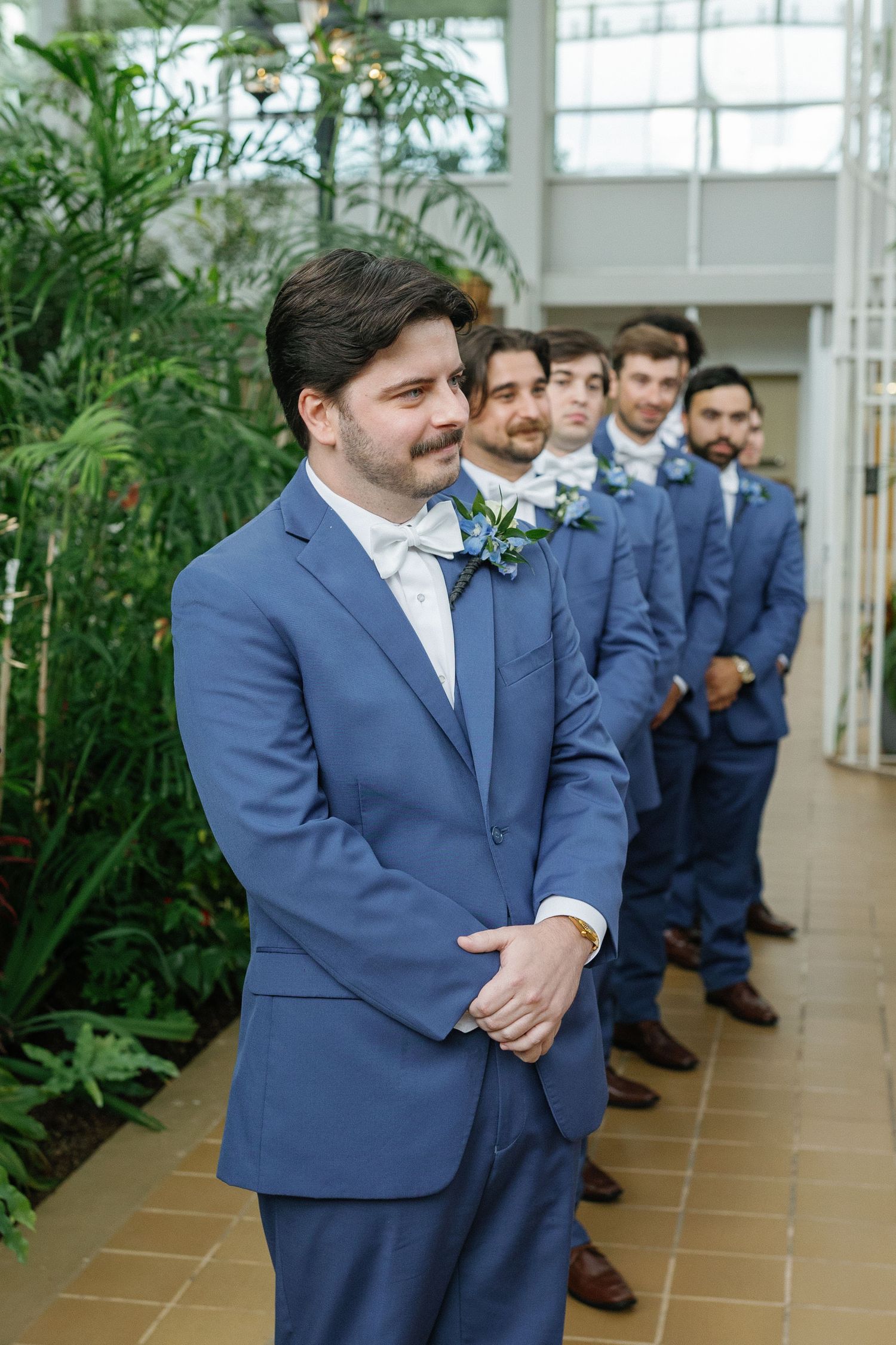 Groom seeing Bride for the first time down asile