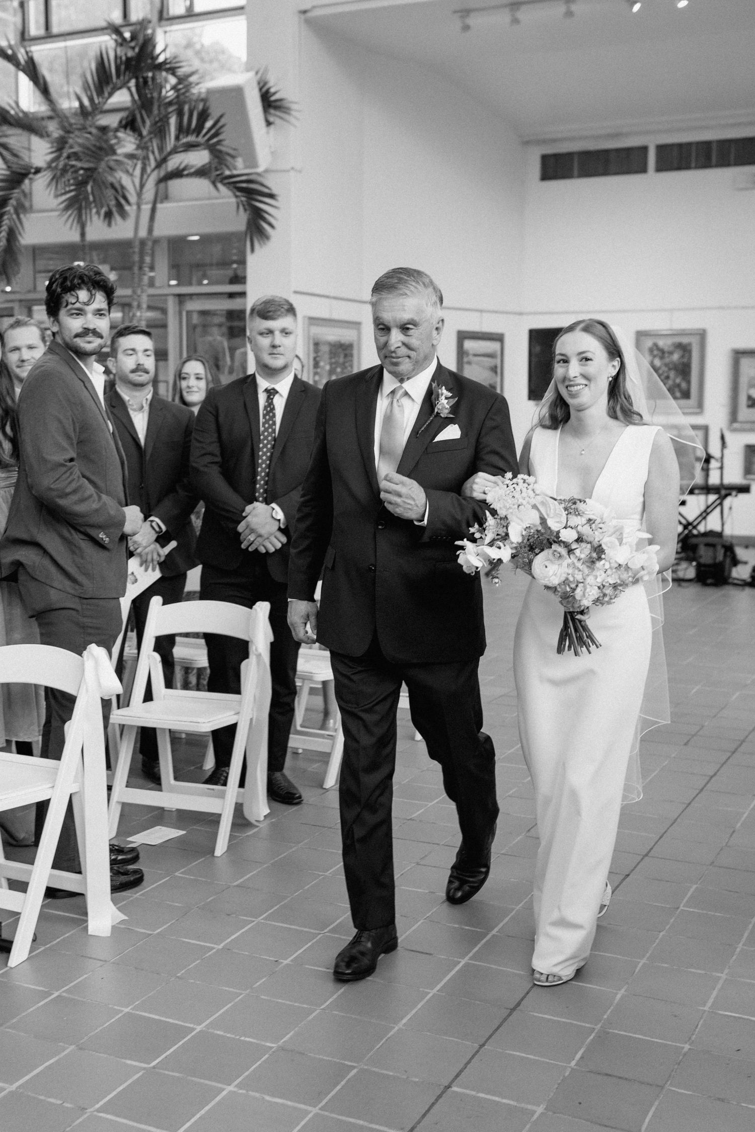 Bride walking down the aisle with her dad on wedding day
