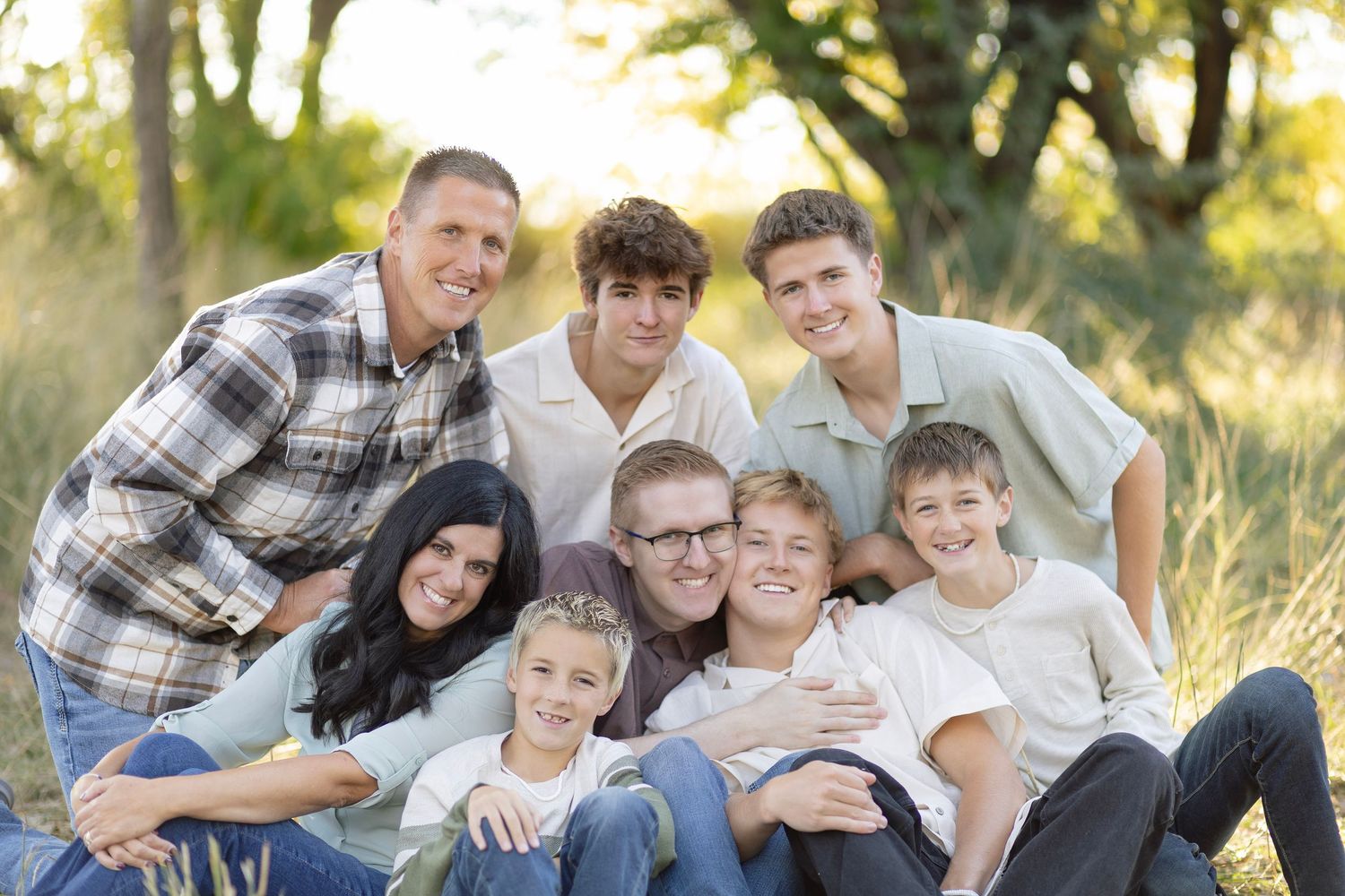 Casual group photo of family members relaxing together outdoors.
