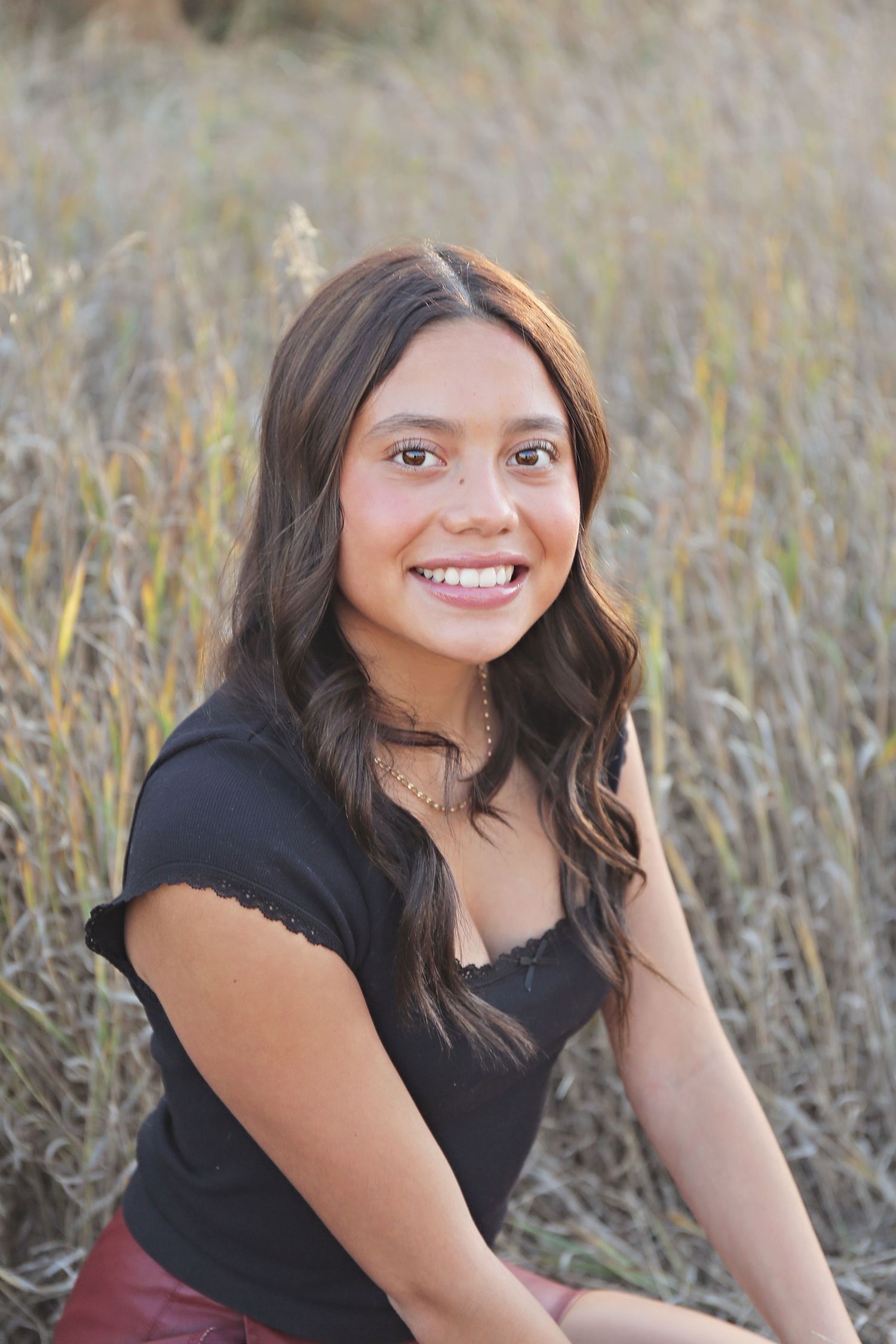 Outdoor portrait series showing genuine smiles against a natural grass background at golden hour.