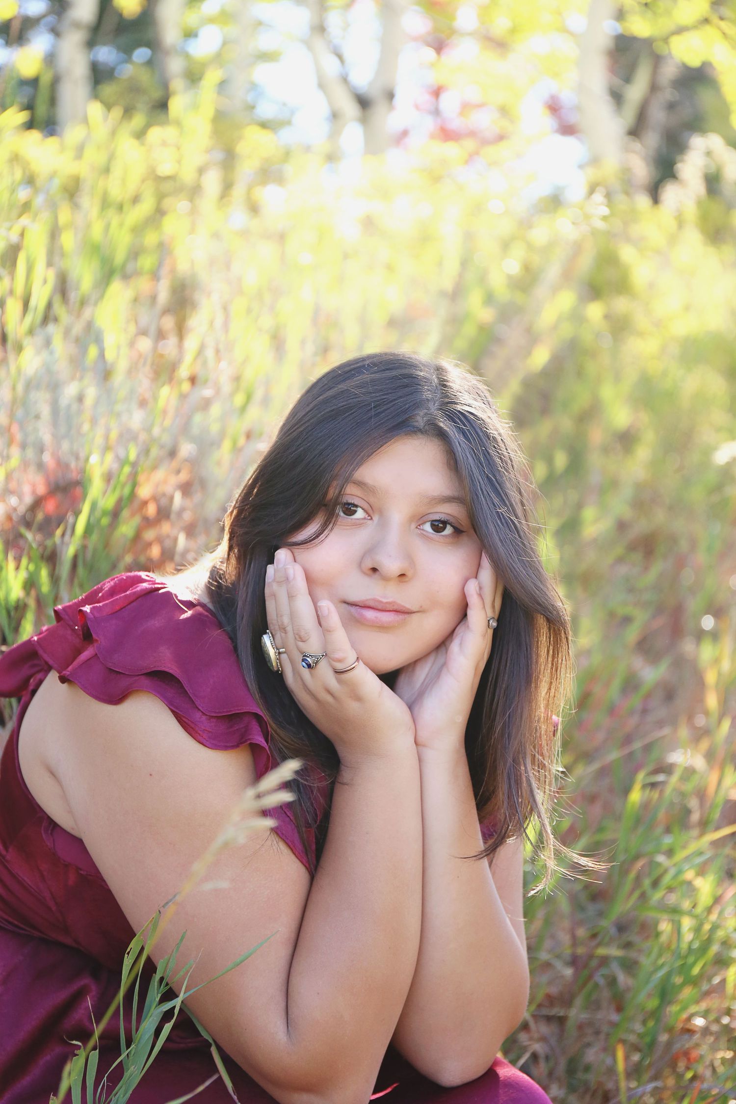 Burgundy dress styled in sunlit meadow with natural summer lighting.